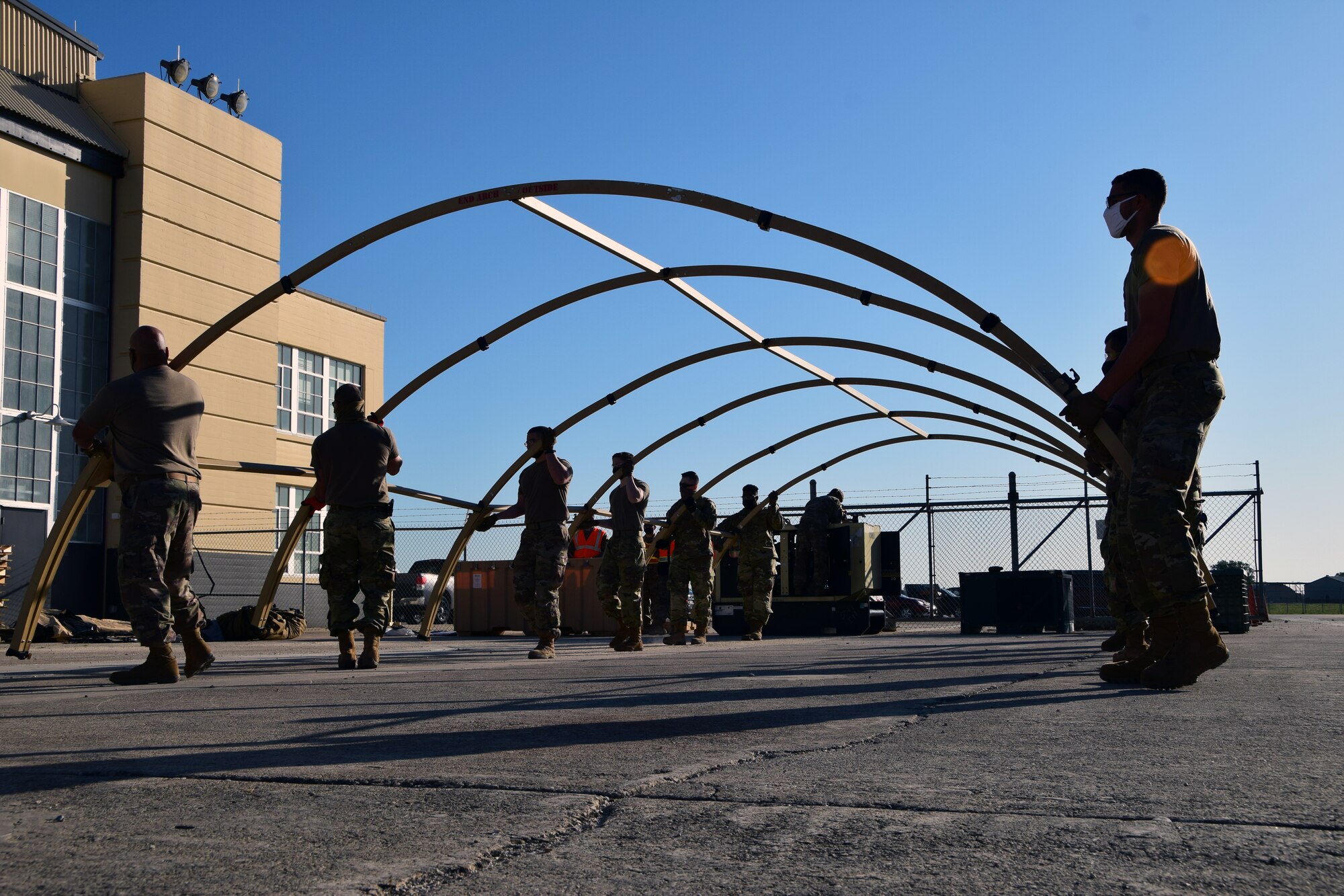 433rd Civil Engineer Squadron Reserve Citizen Airmen assemble a tent May 5, 2021 during the 433rd Airlift Wing’s Exercise Alamo Bravo at Joint Base San Antonio-Lackland, Texas. Once assembled, the tent would be used to house a field kitchen. (U.S. Air Force photo by Tech. Sgt. Iram Carmona)