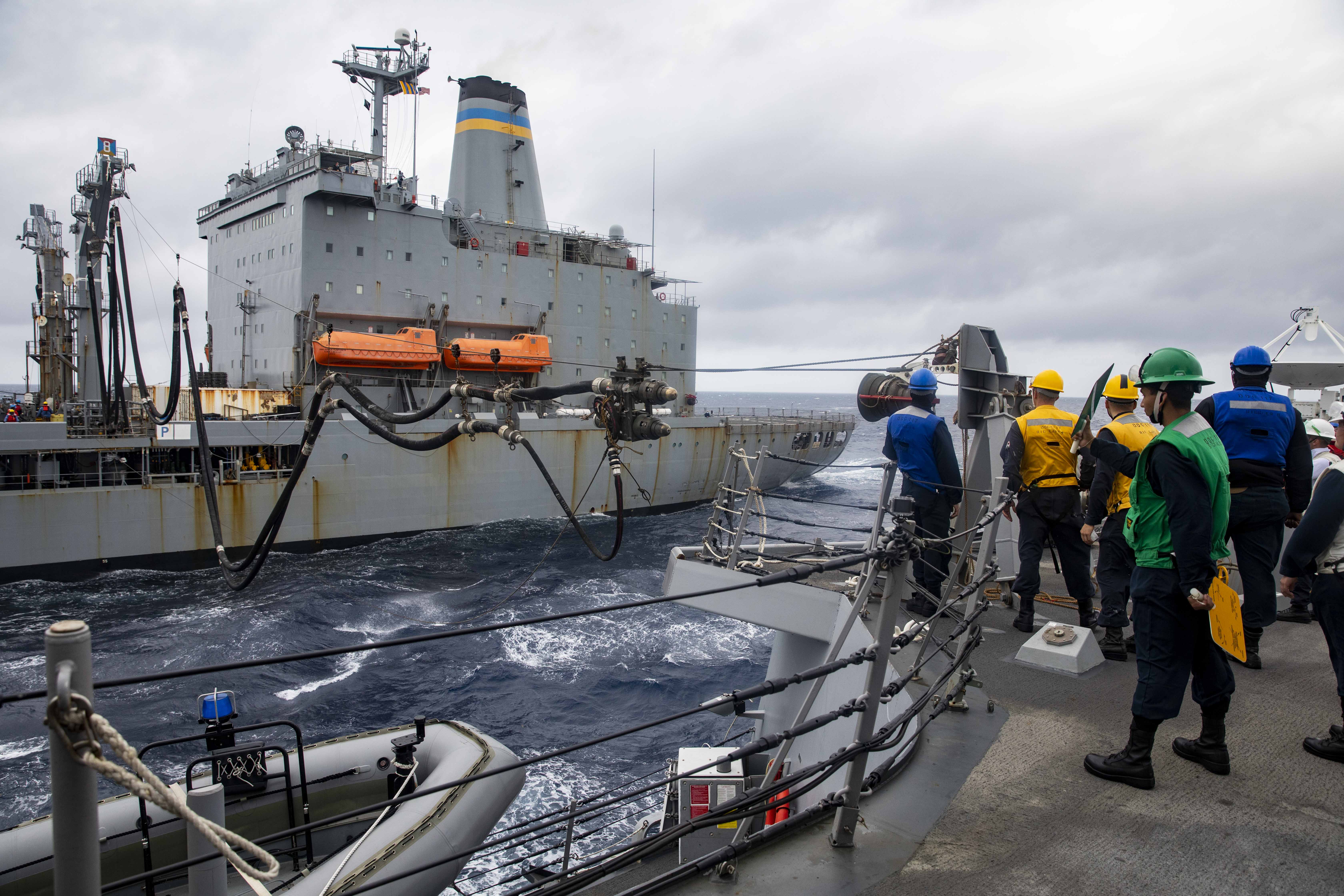 The Arleigh Burke-class guided-missile destroyer USS Paul Ignatius (DDG 117) receives fuel from the fleet replenishment oiler USNS Joshua Humphreys (T-AO 188).
