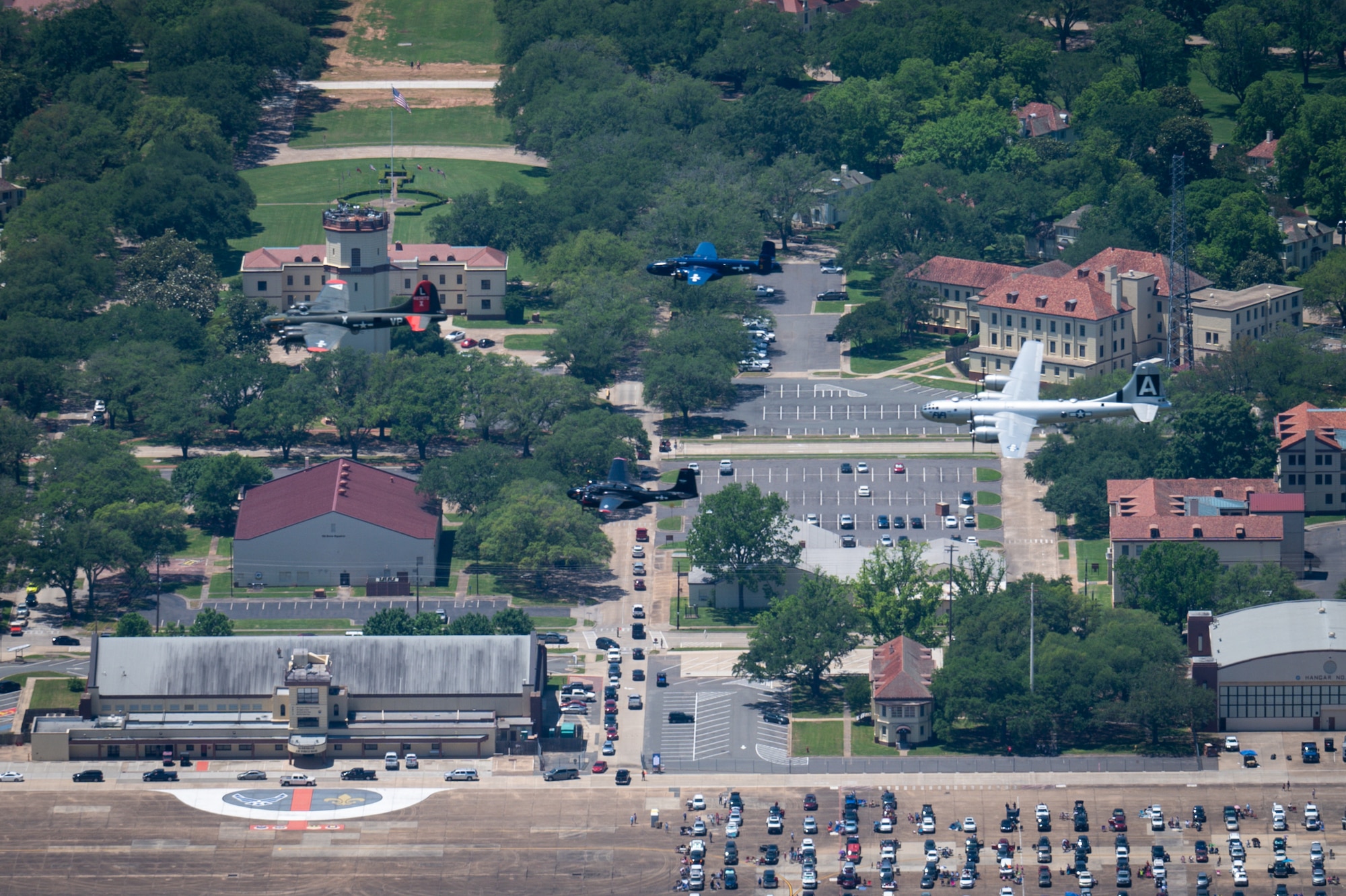 Historic World War II bombers fly over the flightline during the Barksdale Defenders of Liberty Air & Space show at Barksdale Air Force Base, Louisiana, 2021. The Defenders of Liberty airshow was first held in 1933 and is a full weekend of military and civilian aircraft, with performances and displays. (U.S. Air Force photo by Airman 1st Class Chase Sullivan)