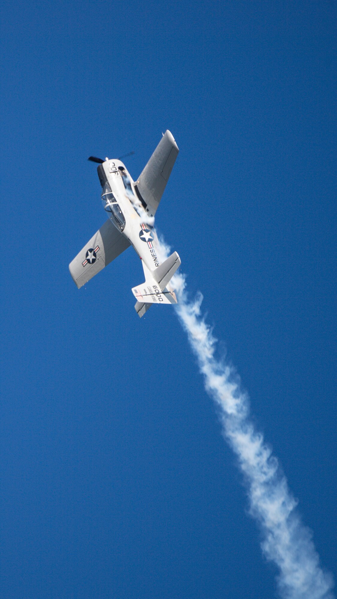 A T-28B Trojan Warbird performs aerial maneuvers during the 2021 Defenders of Liberty Air & Space Show at Barksdale Air Force Base, Louisiana, May 7, 2021. The Barksdale Air Force Base Air & Space Show allows Shreveport-Bossier City to showcase the home of the B-52H Stratofortress, grant access to tour the military installation, view military and aerobatic performers, and support the recruiting arm of our armed forces. (U.S. Air Force photo by Senior Airman Max Miller)