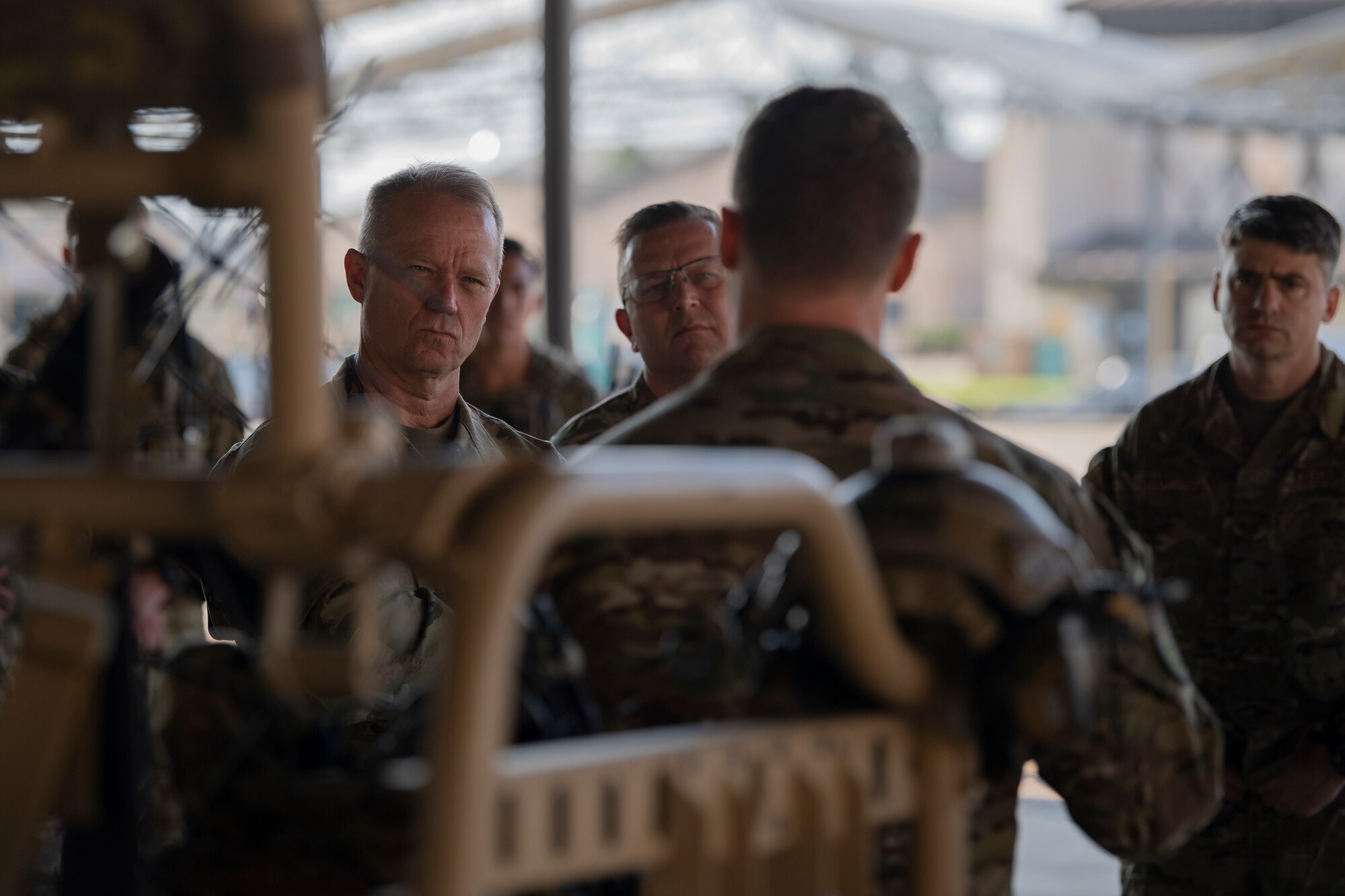 A photo of Airmen listening to a brief.