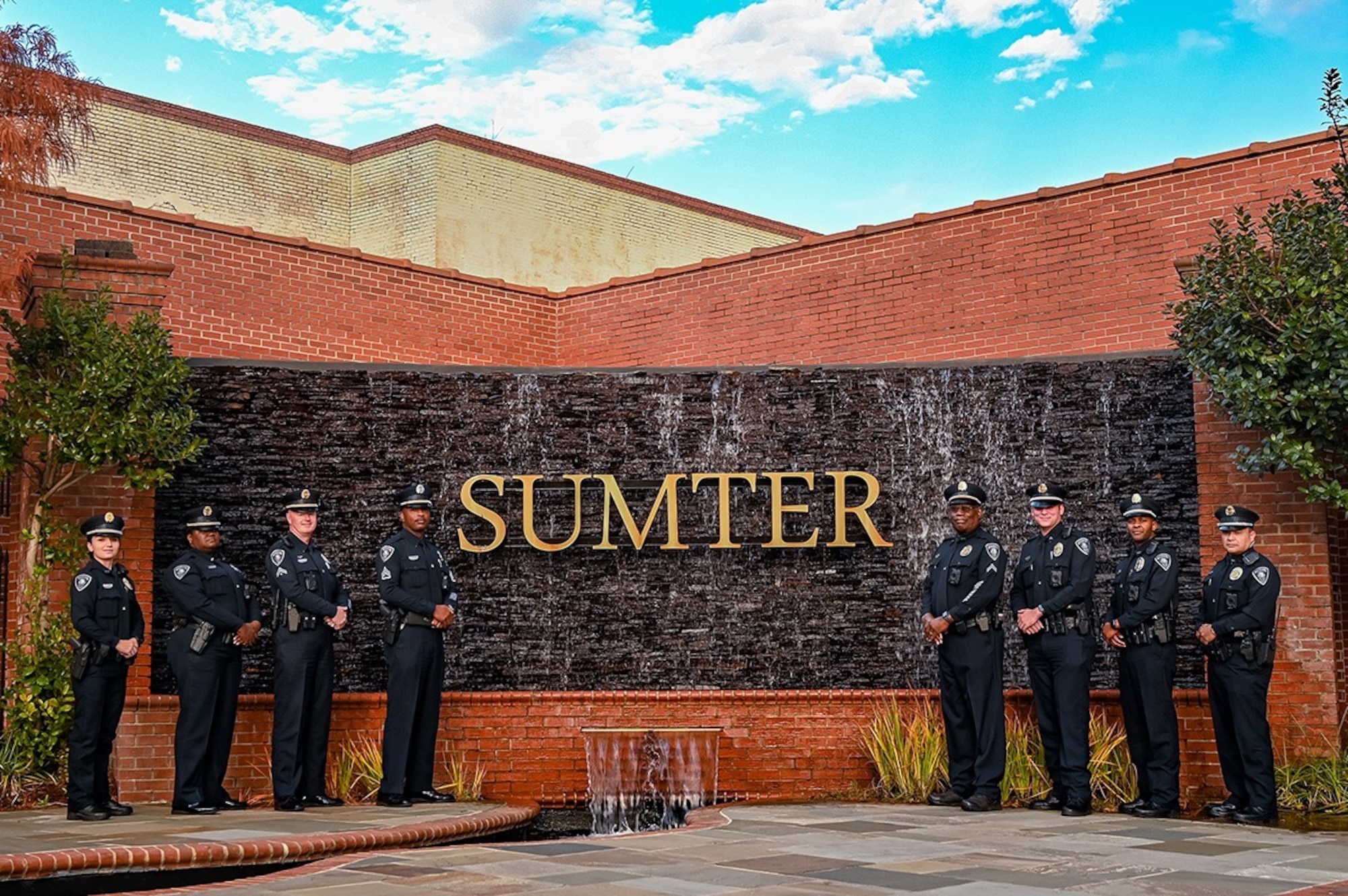 A photo of police officers standing in front of a sign