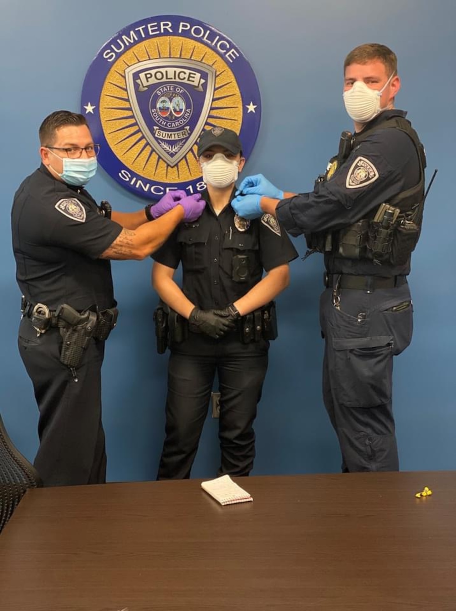 A photo of police officers standing next to each other.