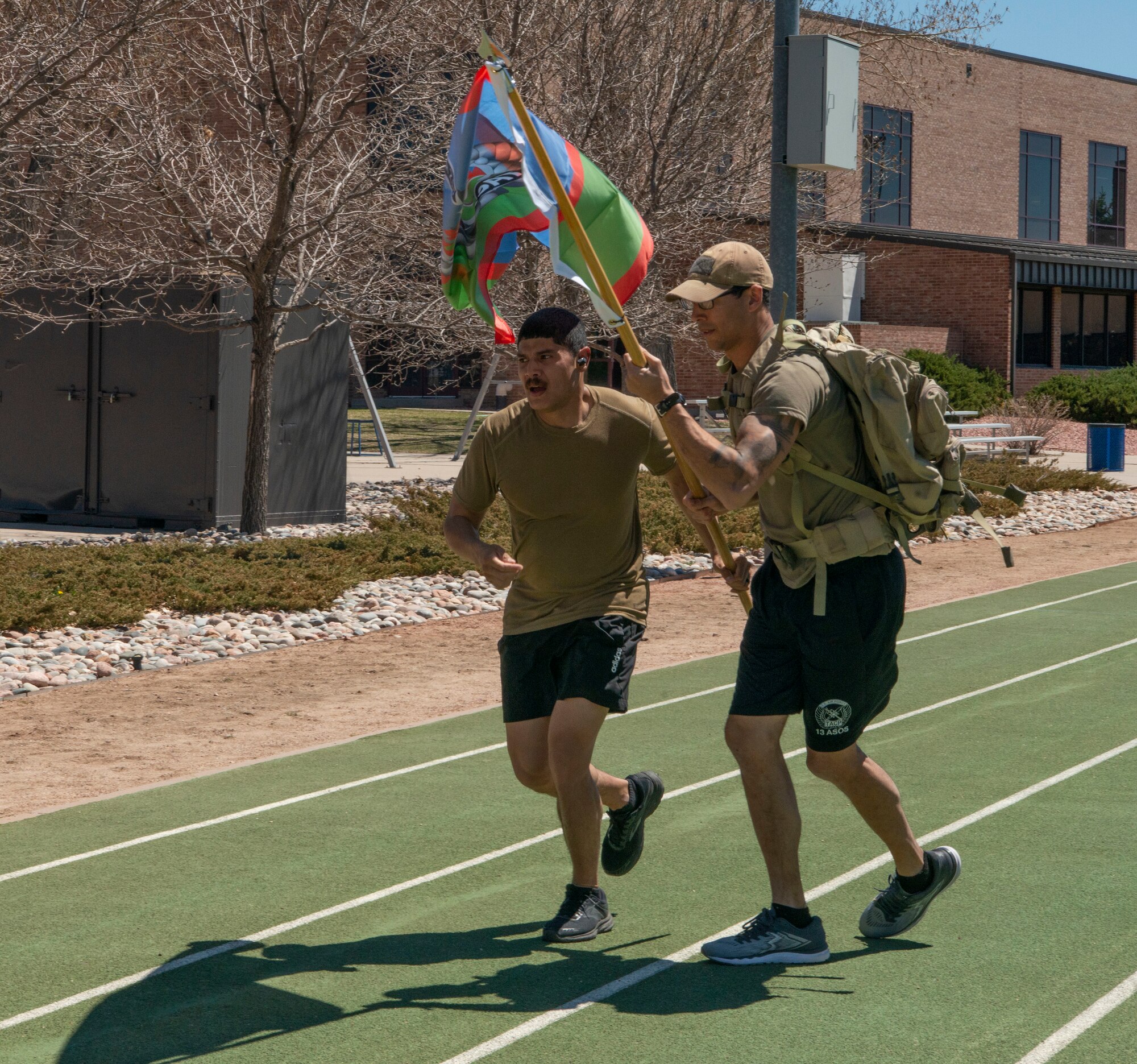 Men running with flag