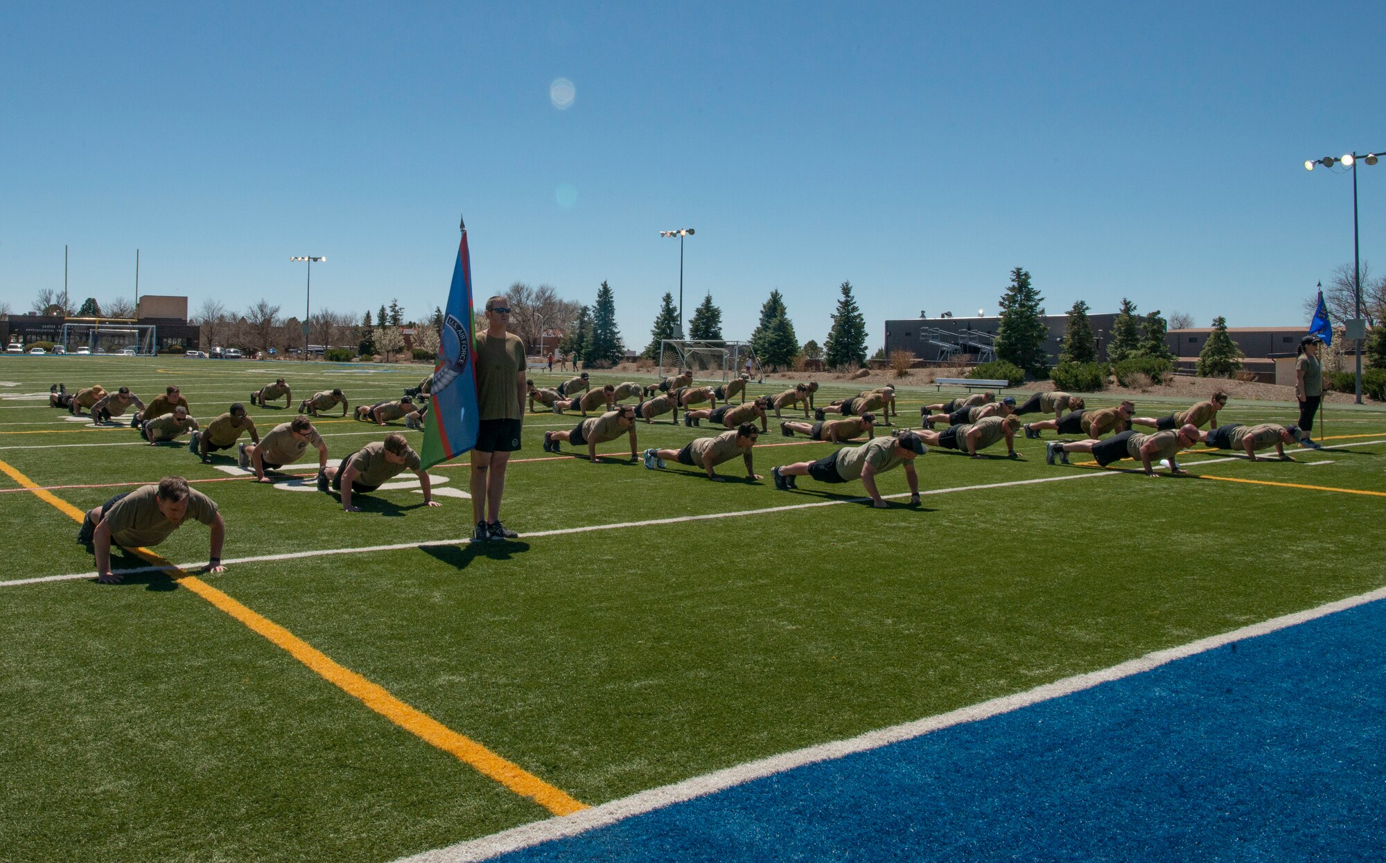People doing pushups.