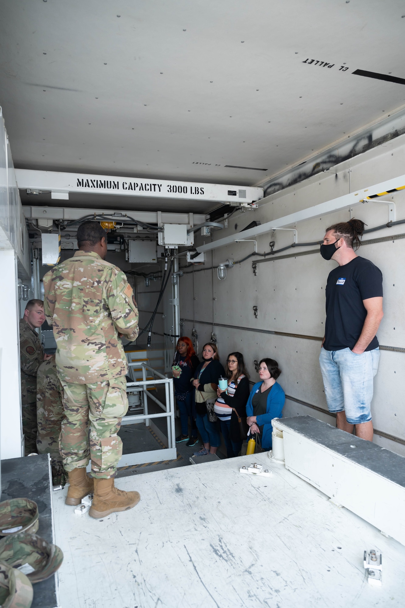 Maintainers from the 341st Missile Maintenance Squadron explain their mission to military spouses inside a weapon transport vehicle during a tour May 7, 2021, at Malmstrom Air Force Base, Mont.