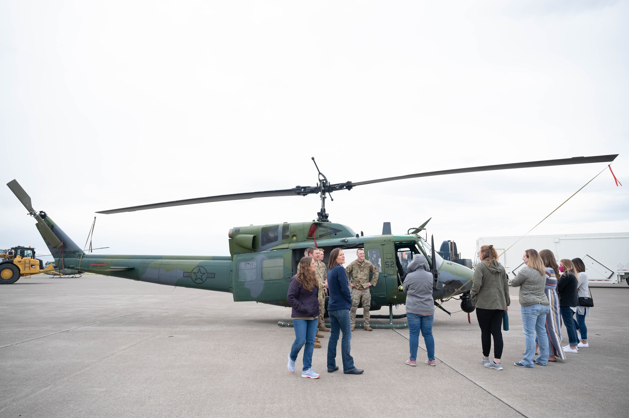 Members of the 40th Helicopter Squadron explain their mission to military spouses and show off a UH-1N "Huey" helicopter during a tour May 7, 2021, at Malmstrom Air Force Base, Mont.