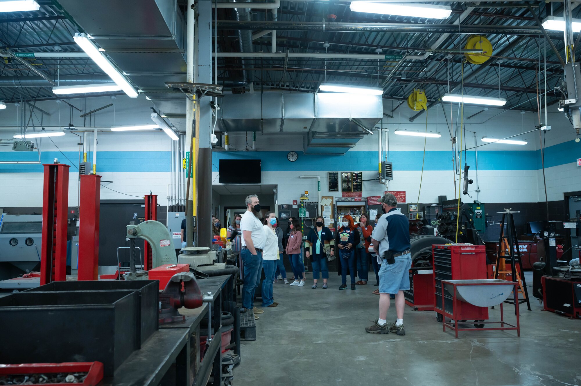 Military spouses visit the auto hobby shop during a Military Spouse Appreciation Day tour May 7, 2021, at Malmstrom Air Force Base, Mont.