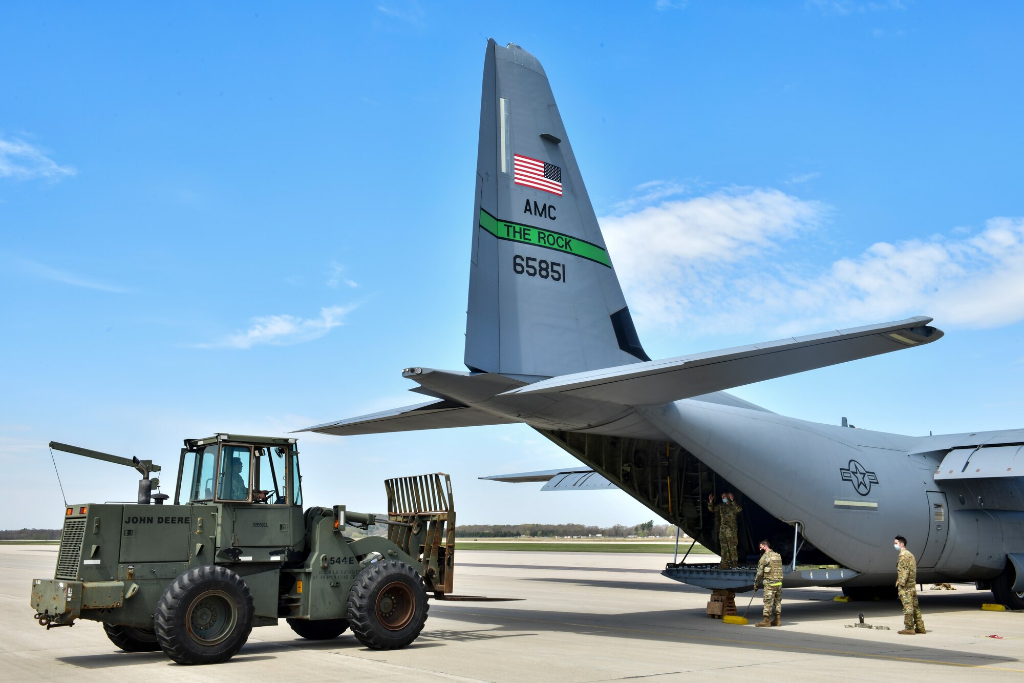 Airmen assigned to the 19th Logistics Readiness Squadron offload cargo from a C-130J Super Hercules