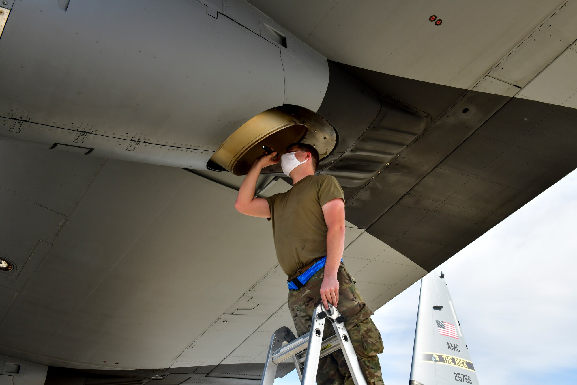 An Airman assigned to the 19th Airlift Wing conducts a post-flight inspection of a C-130J Super Hercules