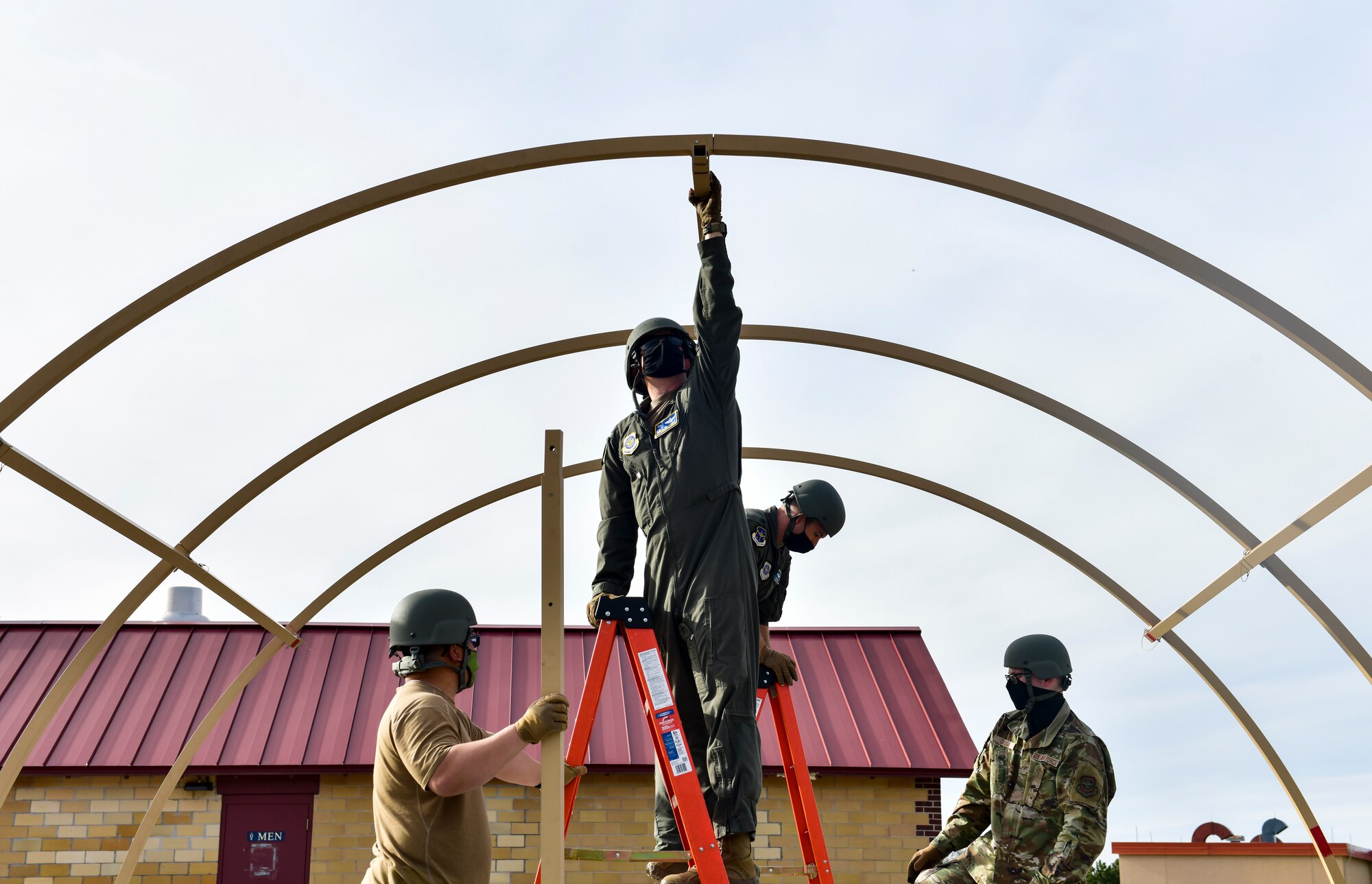 An Airman sets up a military shelter system
