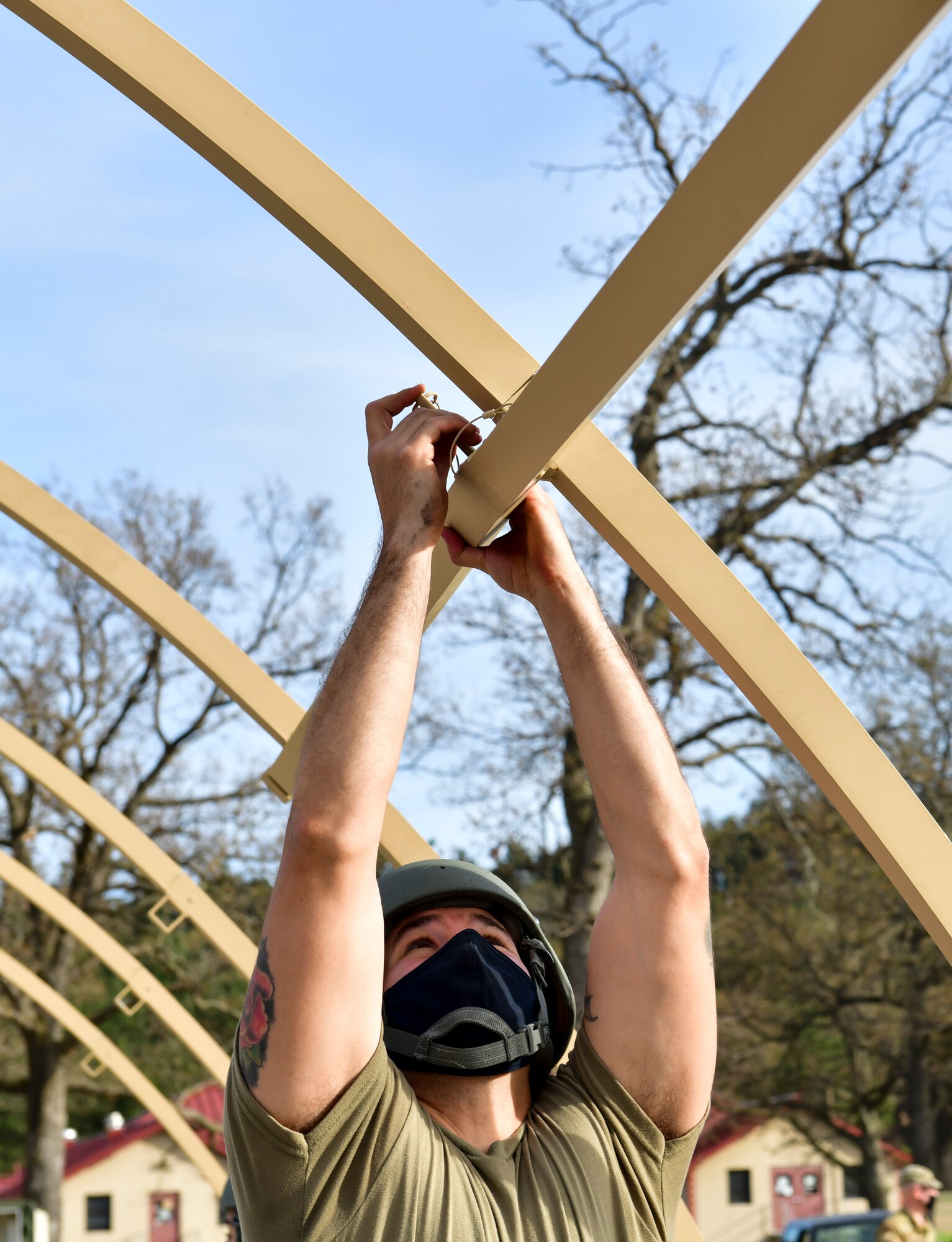 An Airman sets up a military shelter system