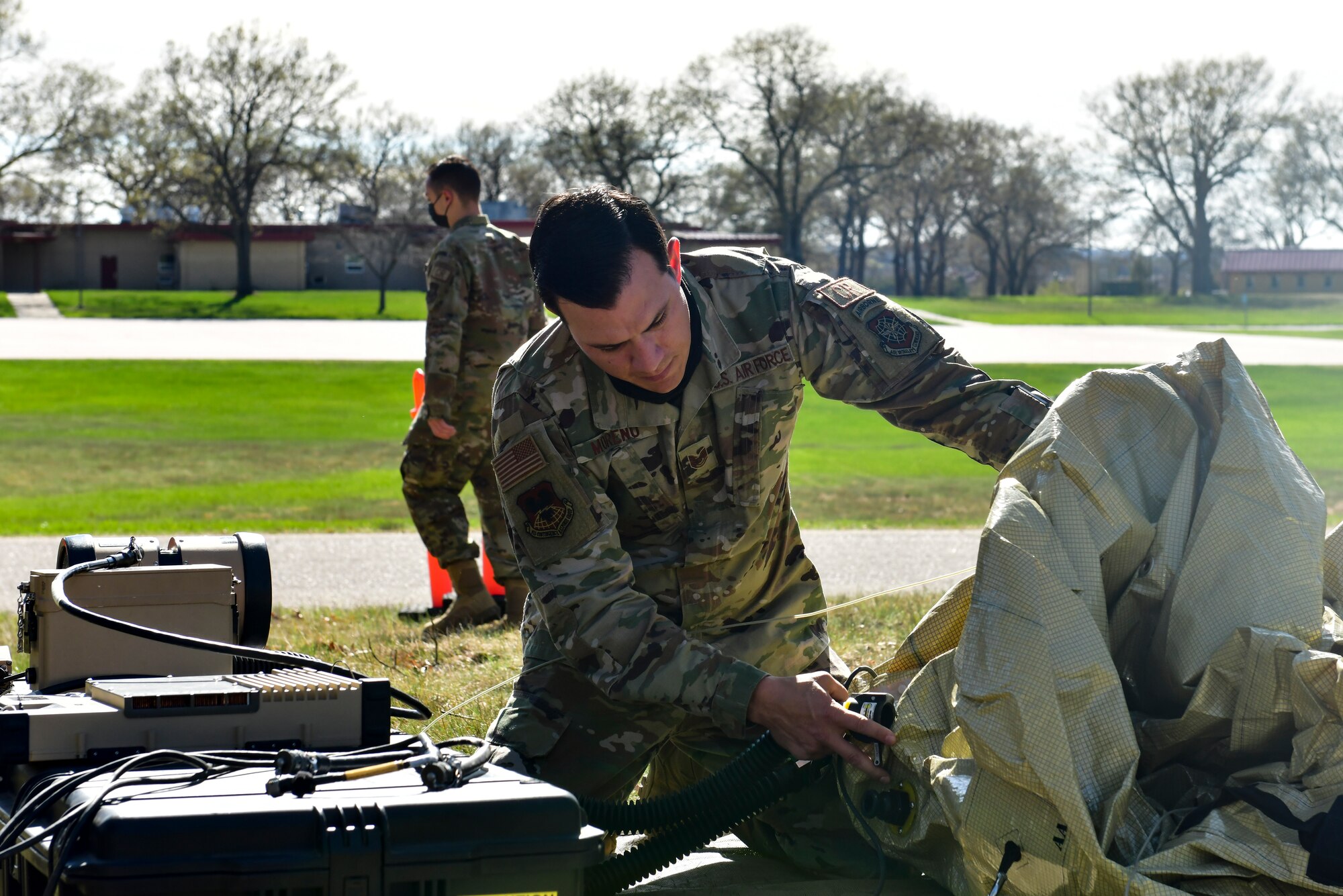 An Airman assembles a small communications package