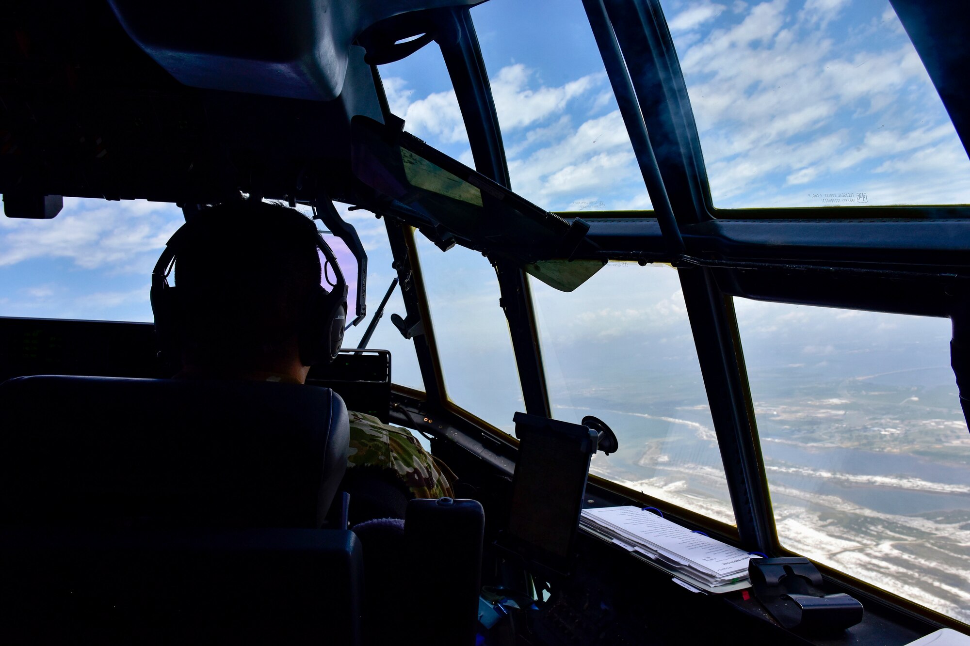 A pilot flies a C-130J Super Hercules