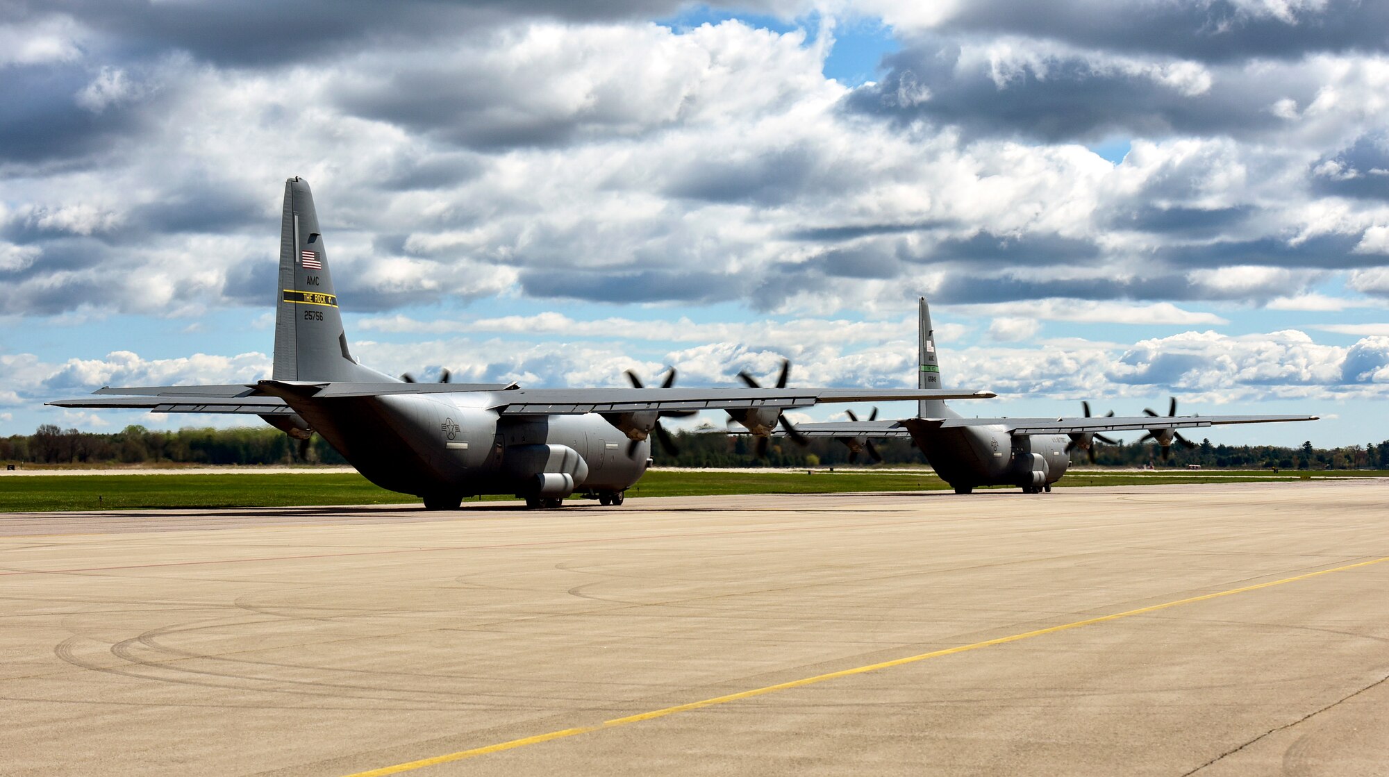 Two C-130J Super Hercules assigned to the 19th Airlift Wing taxi on the flightline at Volk Field Air National Guard Base