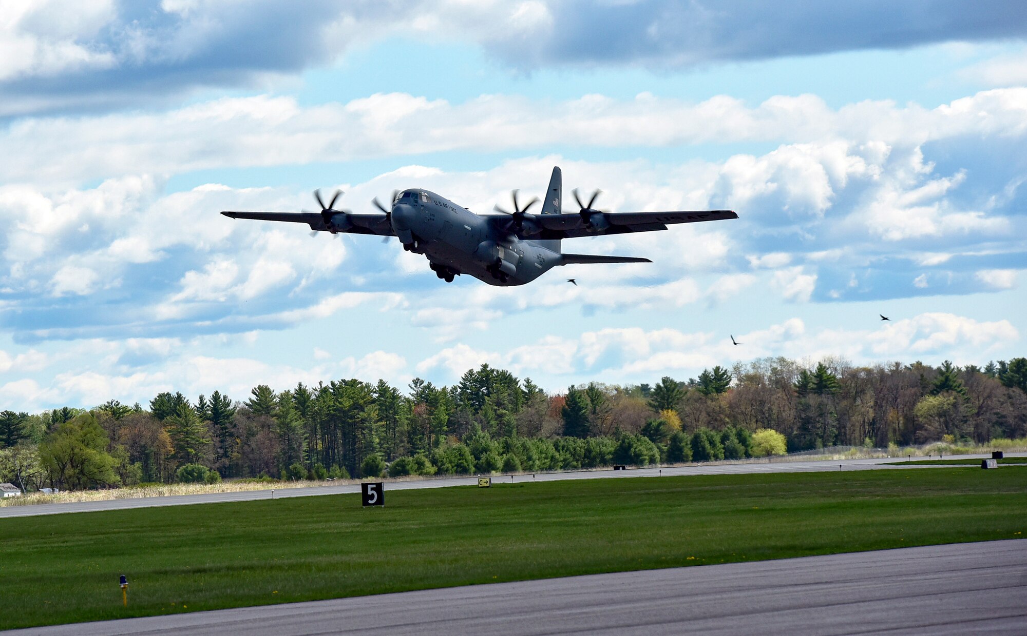 A C-130J Super Hercules assigned to the 19th Airlift Wing takes off from Volk Field Air National Guard Base