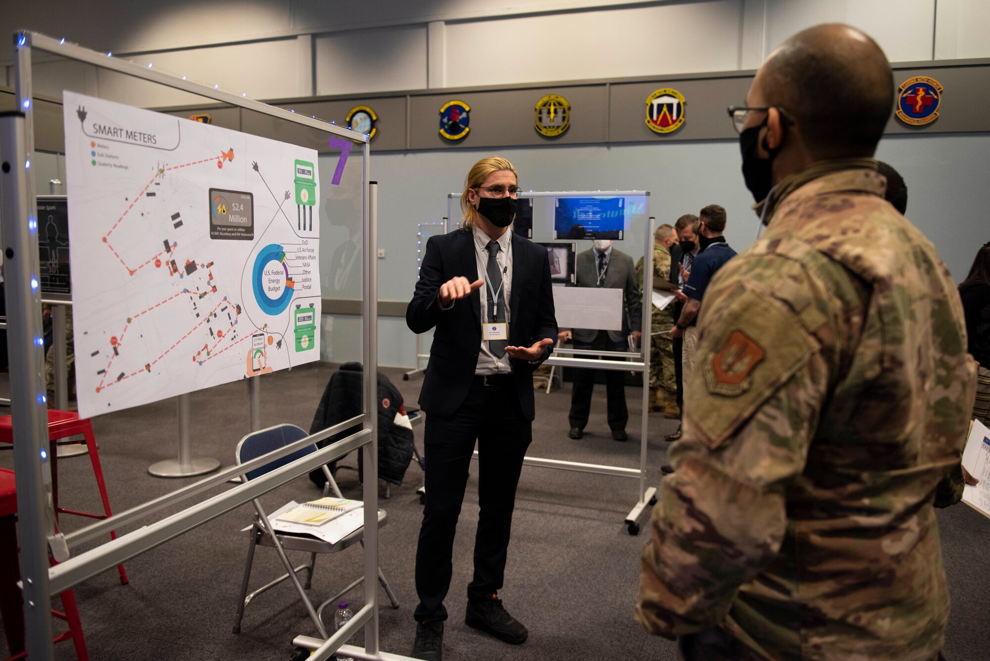 Philip Nikolic, left, 423rd Civil Engineer Squadron base energy manager, presents his idea for a Smart Meter system to the judges at the Pathfinder Innovation Conference 2021 at Royal Air Force Croughton, England, May 6, 2021. The 501st Combat Support Wing hosted its first innovation conference to highlight new ideas and promote a culture of innovation within the wing. (U.S. Air Force photo by Senior Airman Jennifer Zima)
