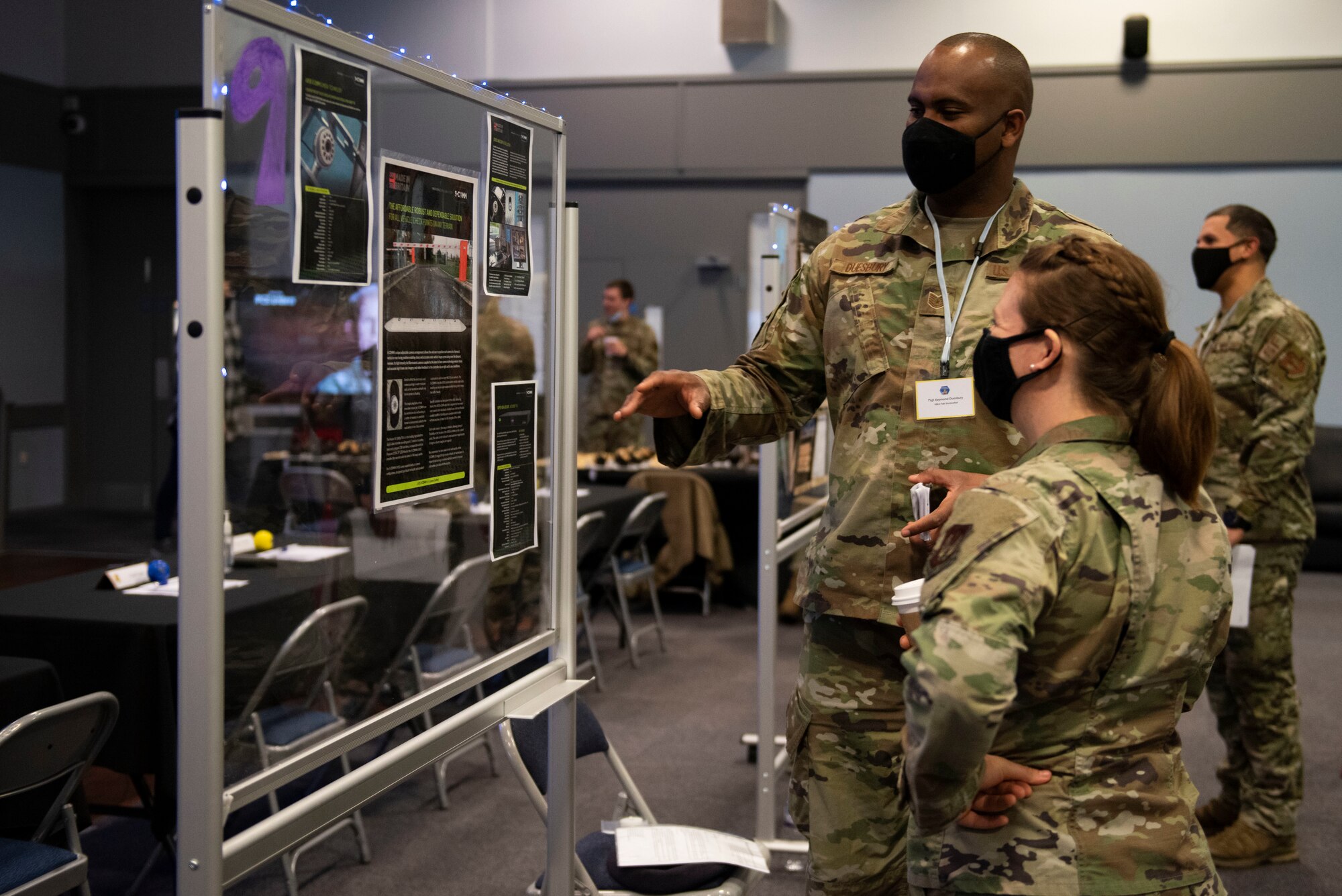 U.S. Air Force Raymond Duesberry, left, 423rd Security Forces Squadron antiterrorism program manager, shares his innovation ideas with Tech. Sgt. Melia Baxter, right, 423rd Medical Squadron noncommissioned officer in charge of dental laboratory, at the Pathfinder Innovation Conference 2021 at Royal Air Force Croughton, England, May 6, 2021. The 501st Combat Support Wing hosted its first innovation conference to highlight new ideas and promote a culture of innovation within the wing. (U.S. Air Force photo by Senior Airman Jennifer Zima)