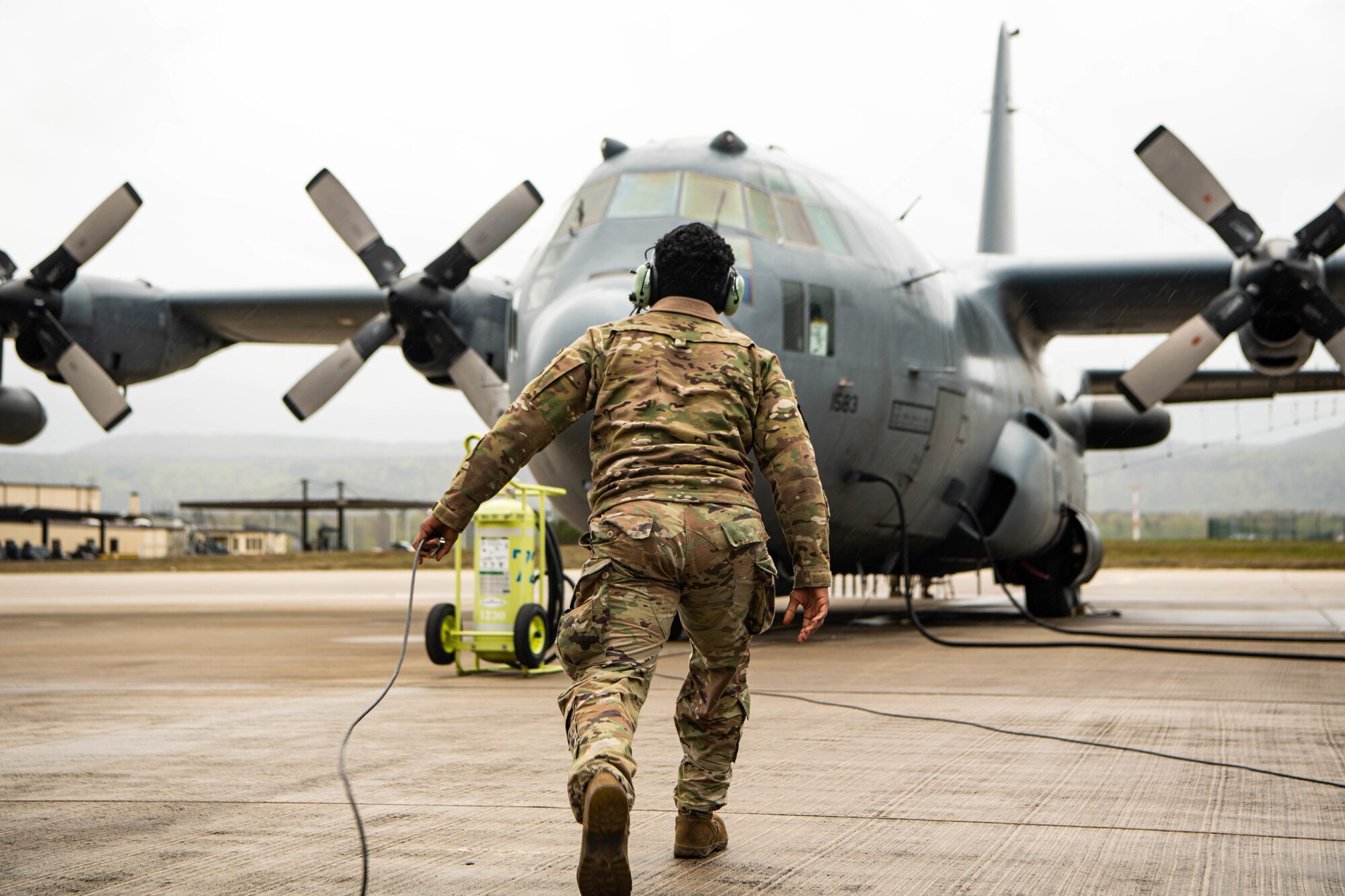 Male Airman prepares aircraft for take-off