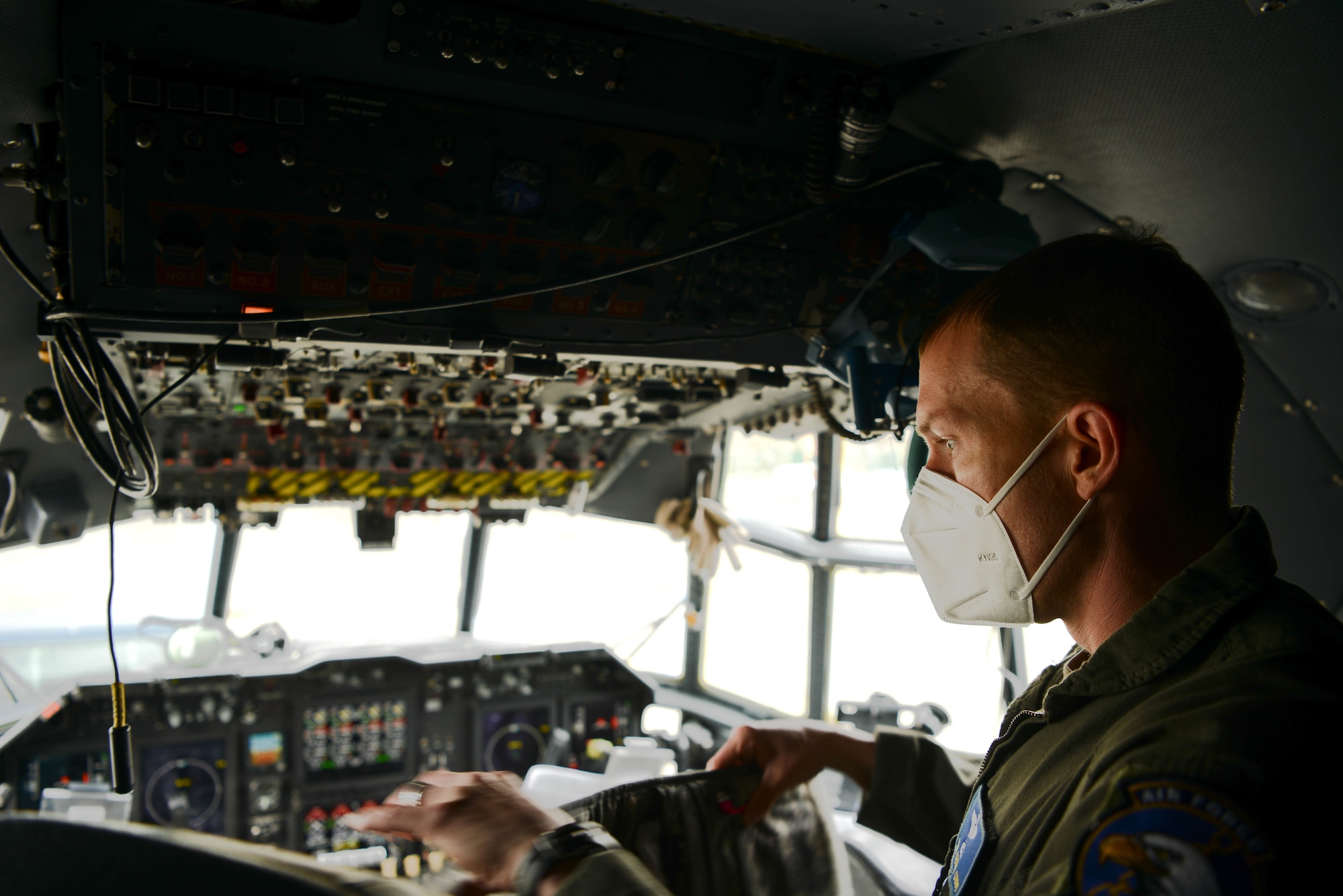 Male pilot operates EC-130H Compass Call aircraft