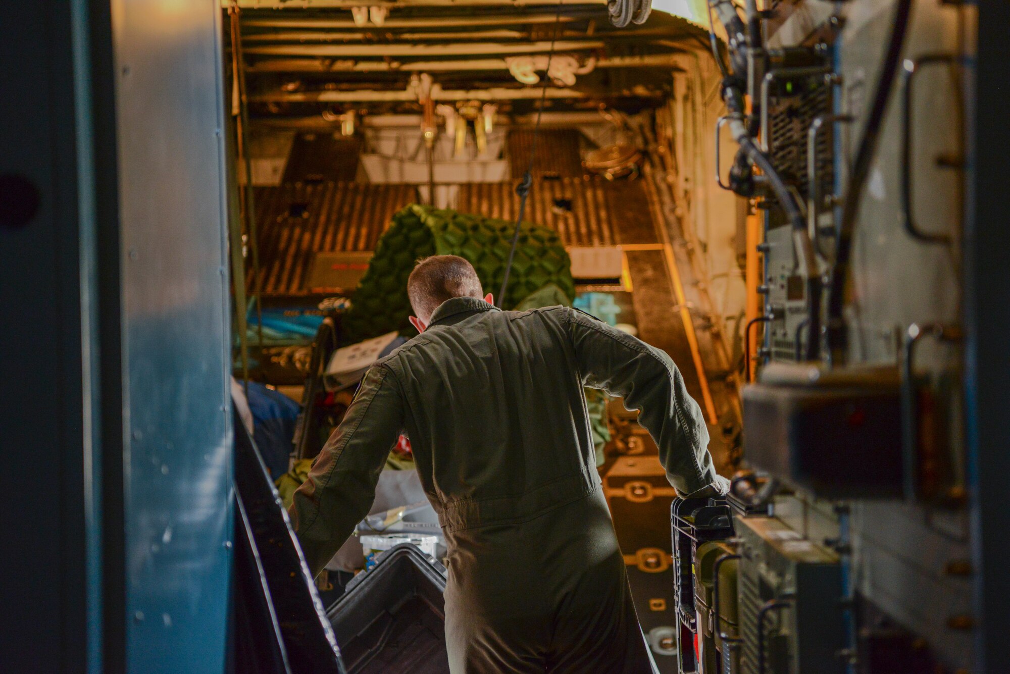 Male Airman loads aircraft