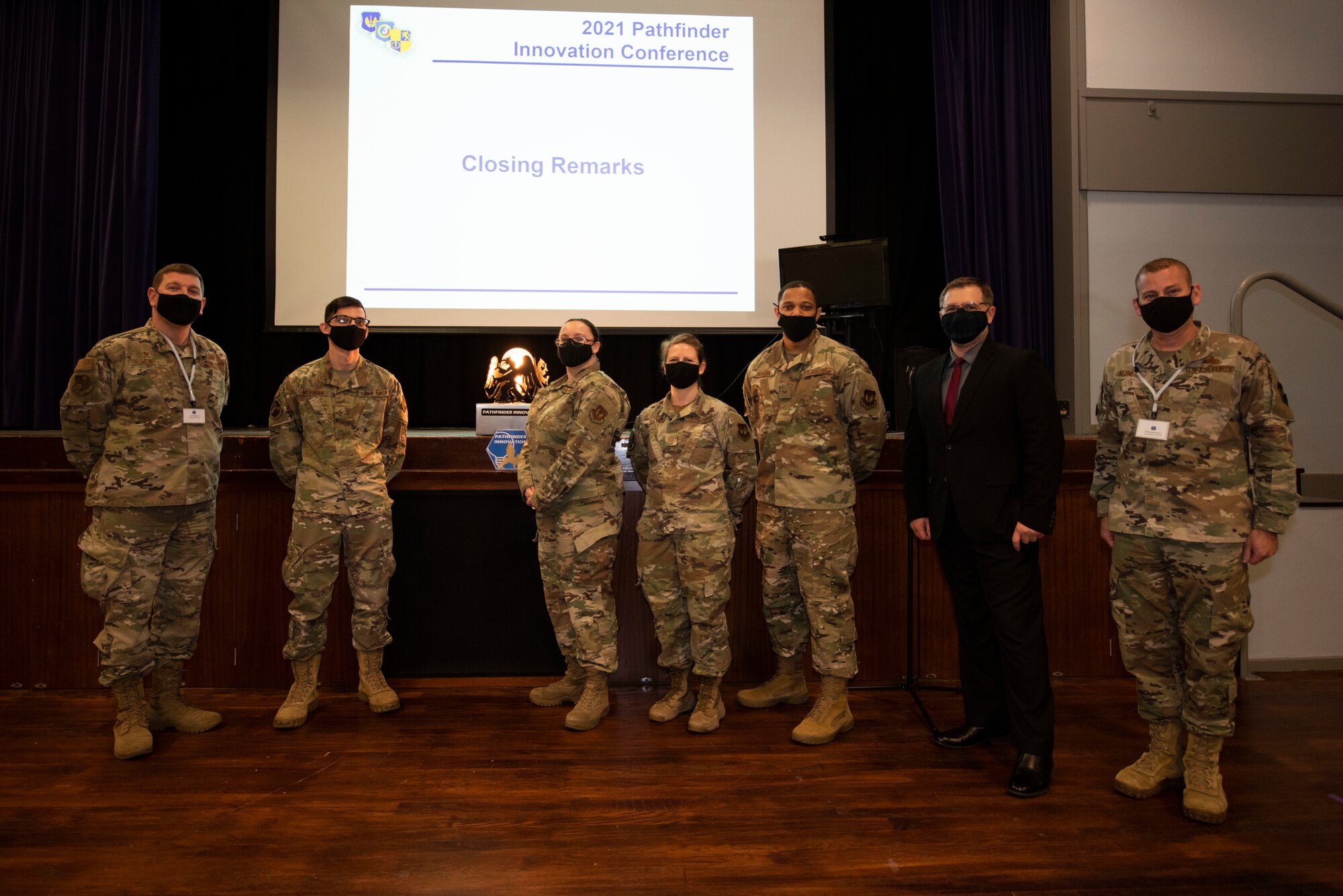 U.S. Air Force Col. Kurt Wendt, left, 501st Combat Support Wing commander, and Chief Master Sgt. Daniel Keene, right, 501st CSW command chief, recognize the winners at the Pathfinder Shark Tank competition at the Pathfinder Innovation Conference 2021 at Royal Air Force Croughton, England, May 6, 2021. The winning Shark Tank presentation, the 423rd Air Base Group, received full funding to implement their innovation. The 501st CSW hosted its first innovation conference to highlight new ideas and promote a culture of innovation within the wing. (U.S. Air Force photo by Senior Airman Jennifer Zima)