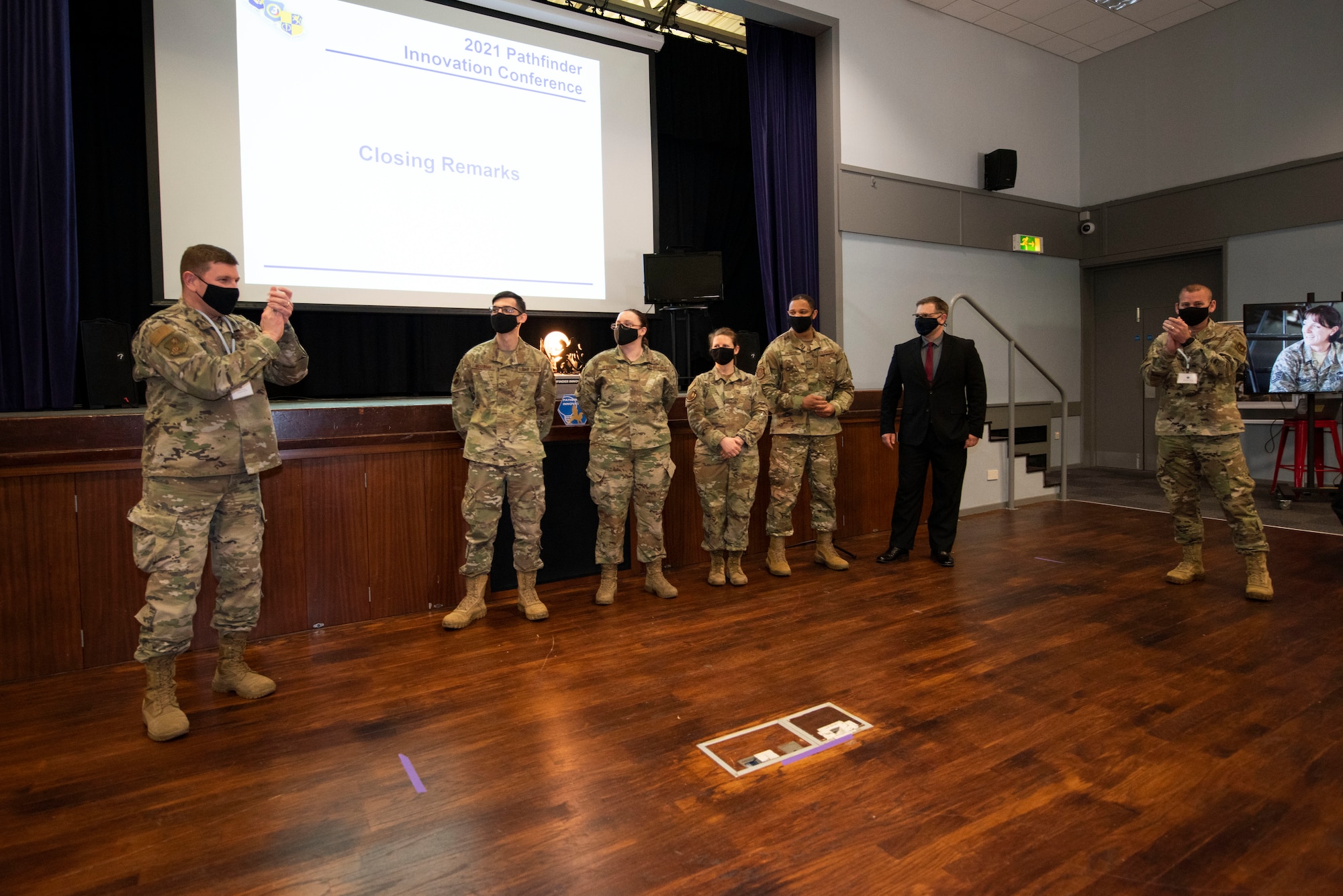 U.S. Air Force Col. Kurt Wendt, left, 501st Combat Support Wing commander, and Chief Master Sgt. Daniel Keene, right, 501st CSW command chief, recognize the winners at the Pathfinder Shark Tank competition at the Pathfinder Innovation Conference 2021 at Royal Air Force Croughton, England, May 6, 2021. The winning Shark Tank presentation, the 423rd Air Base Group, received full funding to implement their innovation. The 501st CSW hosted its first innovation conference to highlight new ideas and promote a culture of innovation within the wing. (U.S. Air Force photo by Senior Airman Jennifer Zima)