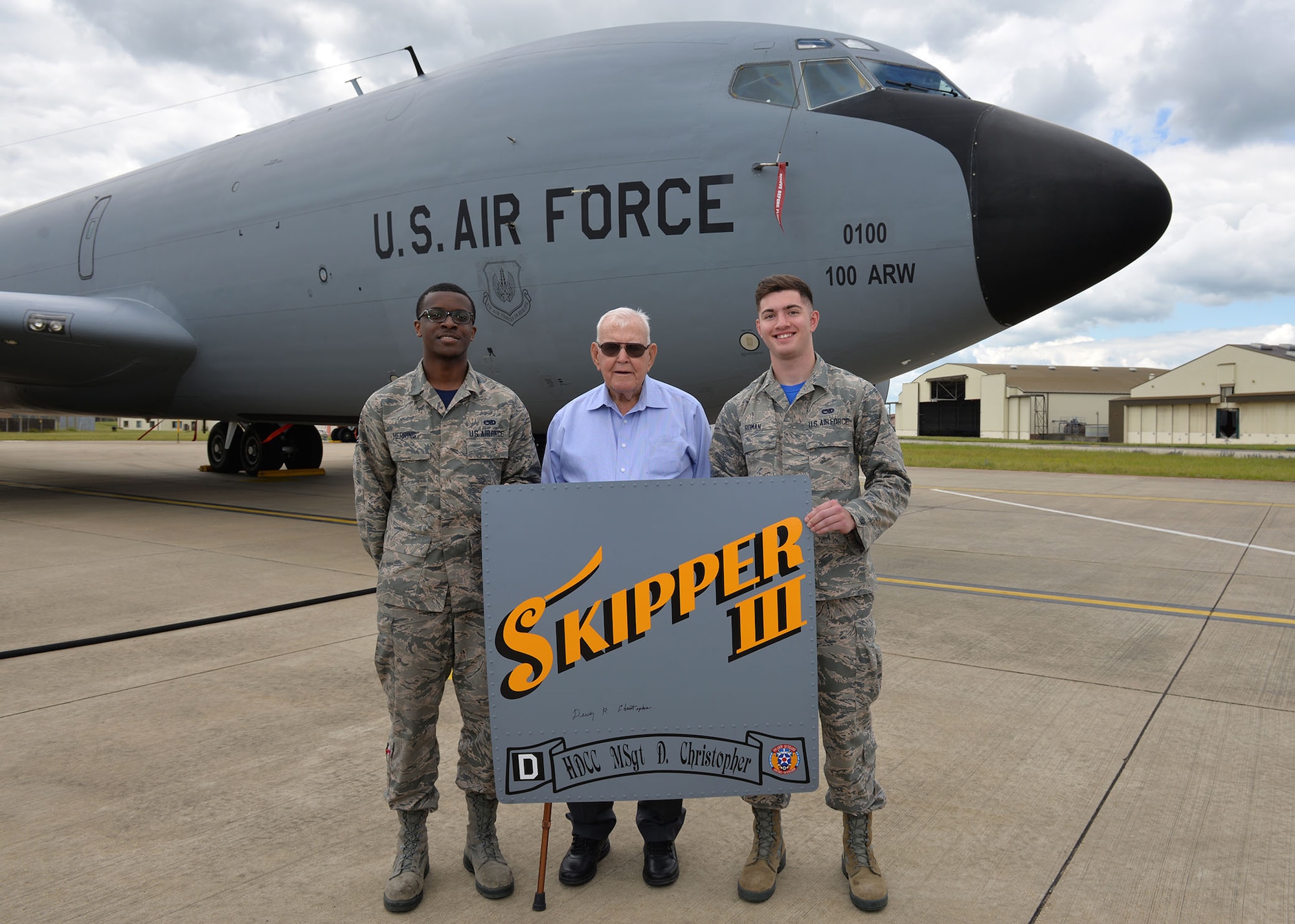 U.S. Air Force Airman 1st Class Isaiah Herring, left, former 100th Aircraft Maintenance Squadron maintainer, and Airman Camden Roman, former 100th Maintenance Squadron maintainer, pose for a photo with retired Master Sgt. Dewey Christopher, a former 351st Bomb Squadron crew chief, 100th Bombardment Group and World War II veteran, during the veteran’s visit to Royal Air Force Mildenhall, England, June 21, 2019. Christopher visited the base to attend a renaming ceremony of the Professional Development Center in his honor. He passed away in October 2019. (U.S. Air Force photo by Karen Abeyasekere)