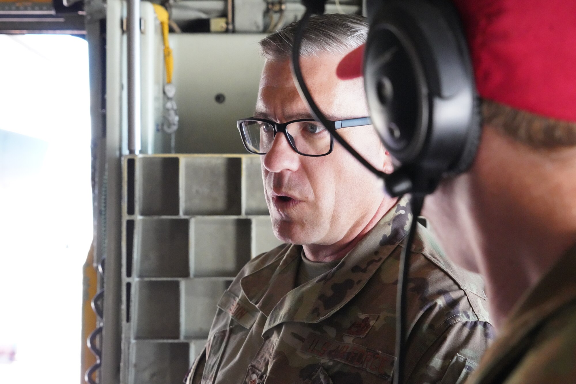 U.S. Air Force Chief Master Sgt. Mikael Sundin, Command Chief Master Sgt. 1st Air Force, tours a C130-E Hercules aircraft from the 152nd Airlift Wing during MAFFS (Modular Airborne Fire Fighting System) training at the San Bernardino Air Tanker Base, California. May 5, 2021. Utilizing C-130 aircraft equipped with the MAFFS unit, Air National Guard aircrew from the 152nd Airlift Wing and the 146th Airlift Wing work together to accomplish their aerial firefighting certification training alongside the U.S. Forest Service and other wildfire prevention agencies. (U.S. Air National Guard photo by Senior Airman Michelle Ulber)