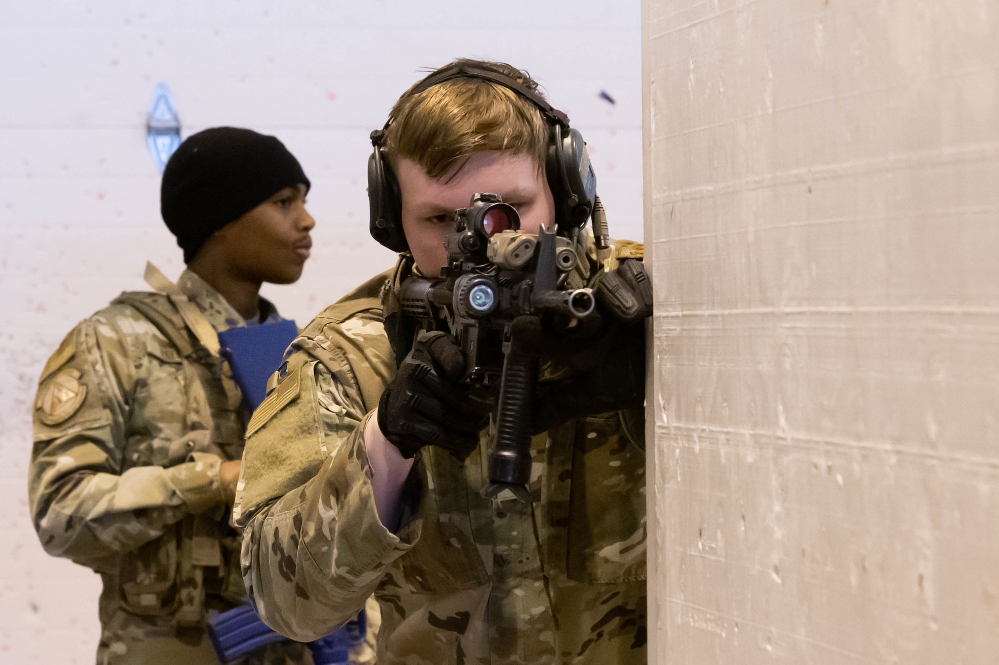 Senior Airman Taylor Tate, right, 341st Missile Security Forces Squadron tactical response force team member and Airman First Class Joshua Haynes, 341st Security Forces Squadron defender, move through the shoot-house during an active shooter training scenario April 27, 2021 at Malmstrom Air Force Base, Mont.