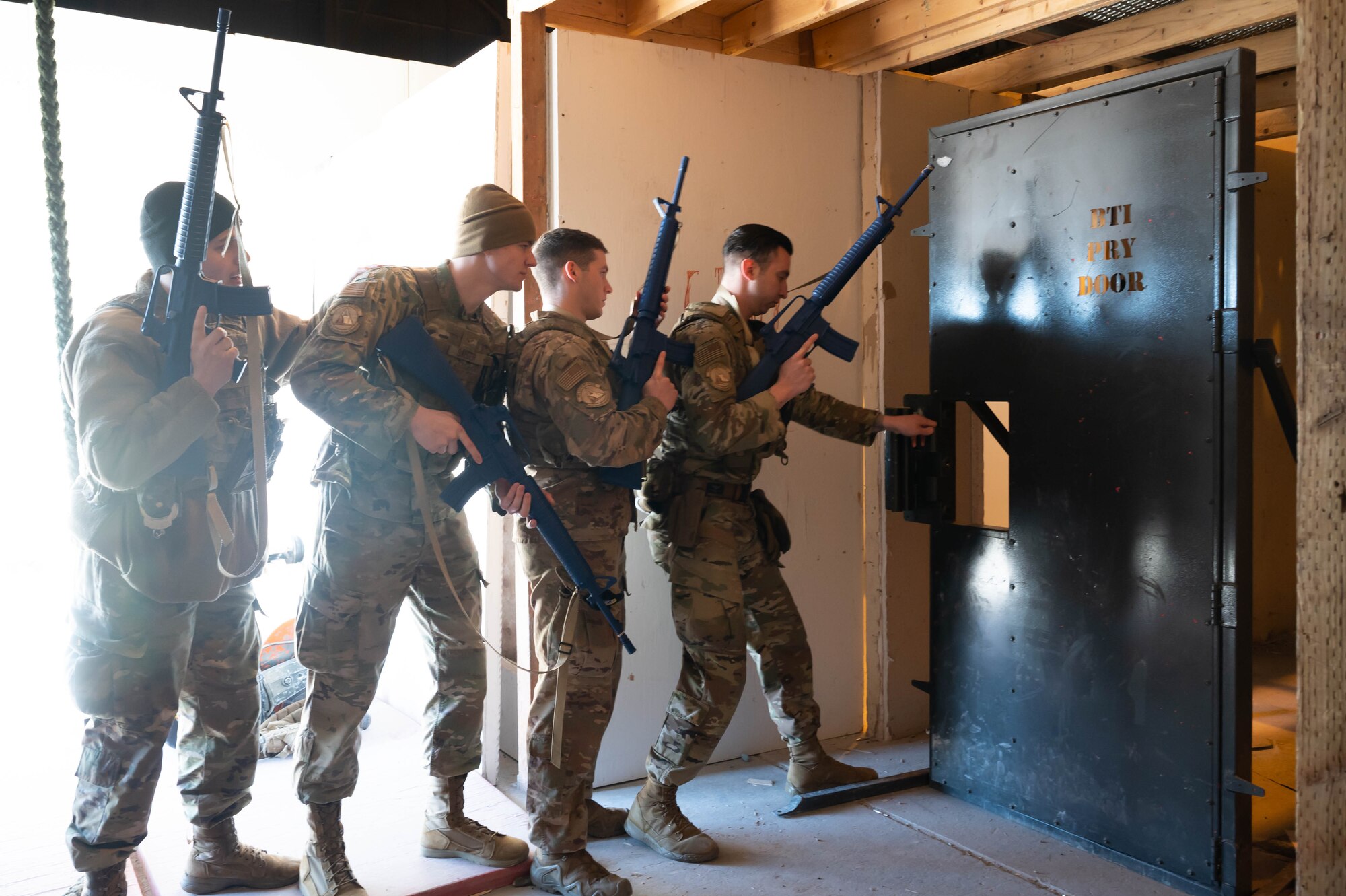 Members of the 341st Security Forces Squadron participate in breach training April 27, 2021 at the shoot-house at Malmstrom Air Force Base, Mont.