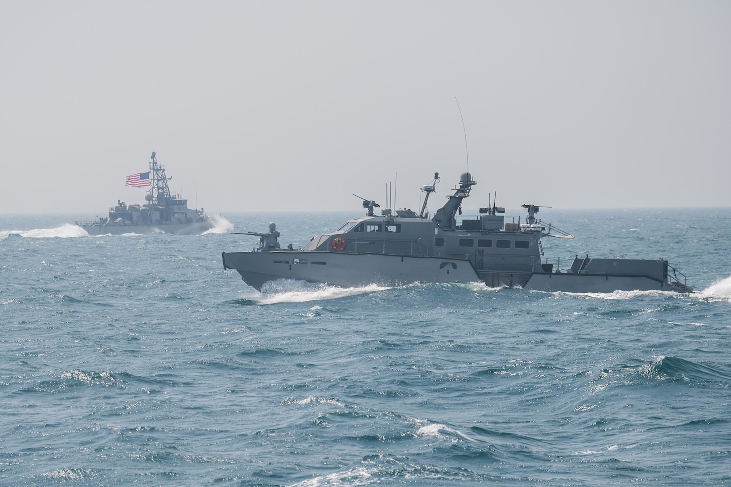 210305-N-DS741-1547 ARABIAN GULF (March 5, 2021) – A Mark VI patrol boat, right, attached to Commander, Task Force (CTF) 56, and patrol coastal ship USS Typhoon (PC 5), conduct defensive maneuvering techniques during Coalition Task Force (CTF) Sentinel led training in the Arabian Gulf, March 5. CTF Sentinel, the operational arm of the International Maritime Security Construct, is a multinational maritime effort to promote freedom of navigation and reassure merchant shipping by deterring and exposing state-sponsored malign activity that threatens security of the maritime commons in the Arabian Gulf, Strait of Hormuz, Gulf of Oman, Gulf of Aden, Bab el-Mandeb Strait and Southern Red Sea. (U.S. Navy photo by Mass Communication Specialist 3rd Class Zachary Pearson/Released)
