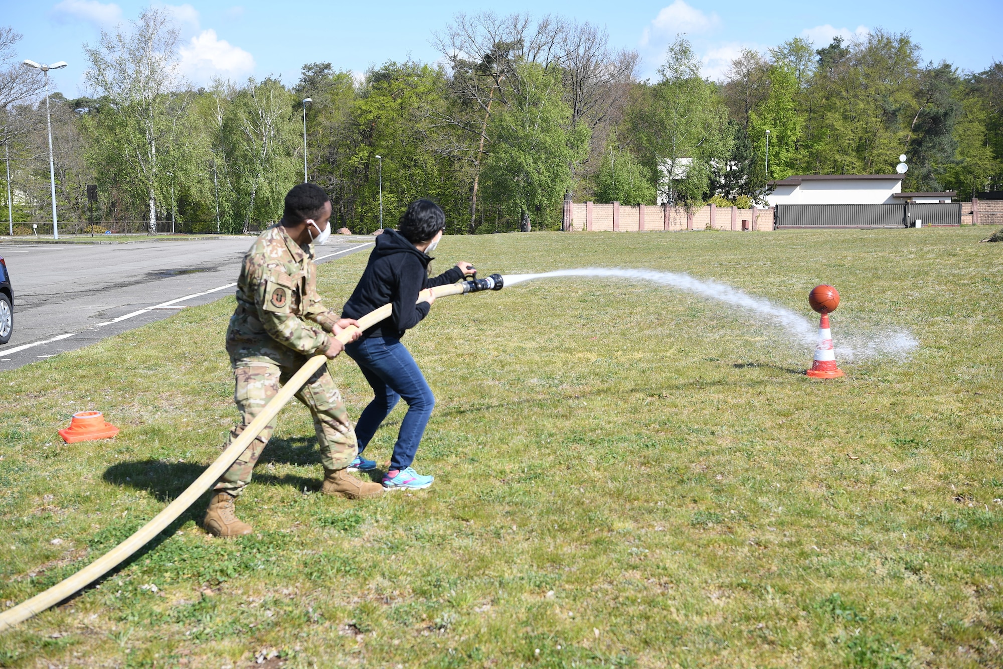 woman holds hose