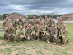 Soldiers from 1st Battalion, 171st Aviation Regiment (General Support Aviation Battalion), shaved their heads and posed for a picture at North Fort Hood, Texas, before deploying to the Middle East with Task Force Phoenix. They shaved their heads in support of Staff Sgt. Brandon Stafford's sister, who was going through chemotherapy and radiation treatment after having a brain tumor removed.