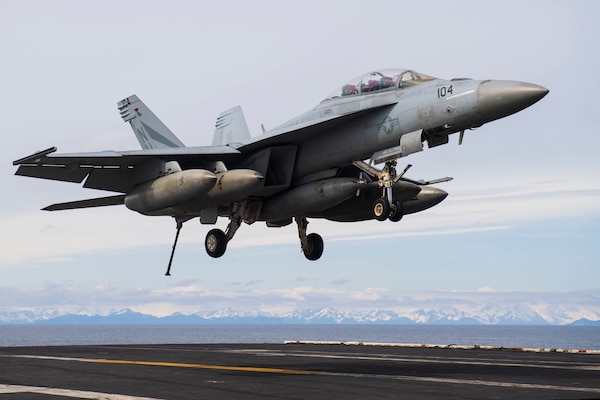 An F/A-18F Super Hornet approaches the flight deck of the aircraft carrier USS Theodore Roosevelt (CVN 71), May 7, 2021, in support of flight operations.