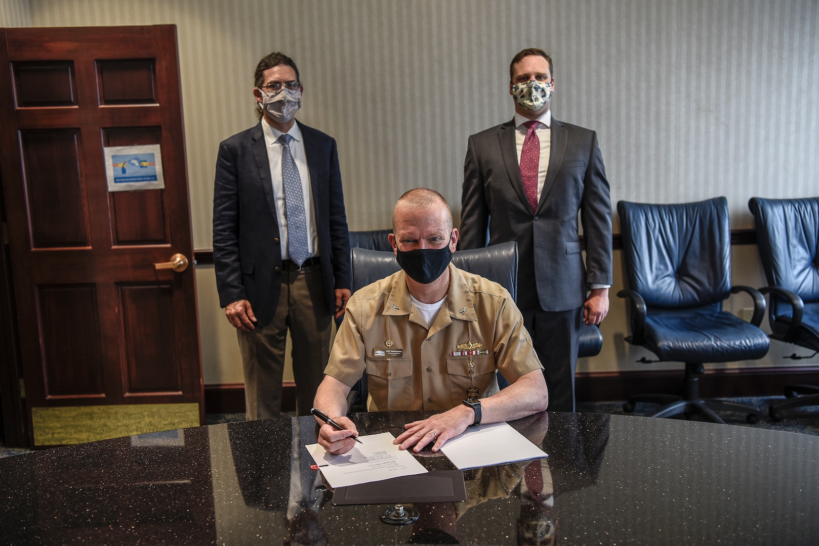 Capt. Todd Hutchison signs a Cooperative Research and Development Agreement (CRADA) between Naval Surface Warfare Center, Carderock Division (NSWCCD) and Thermal Compaction Group (TCG) on April 29, 2021.