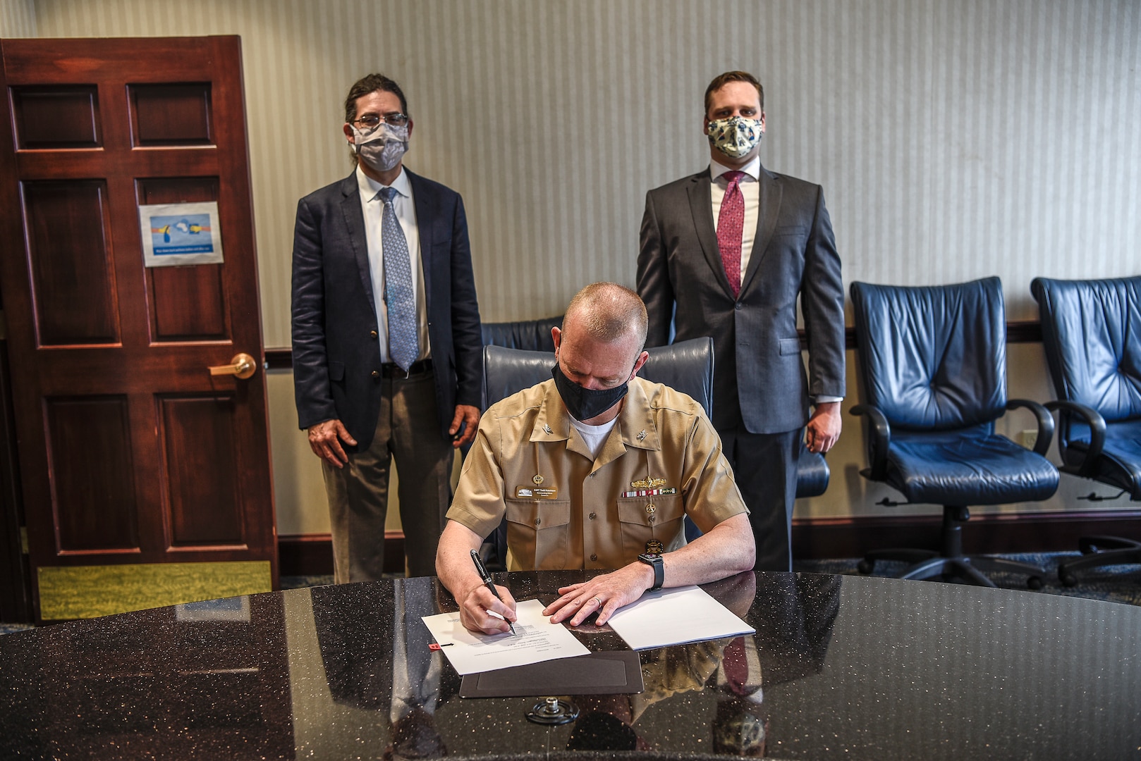 Capt. Todd Hutchison signs a Cooperative Research and Development Agreement (CRADA) between Naval Surface Warfare Center, Carderock Division (NSWCCD) and Thermal Compaction Group (TCG) on April 29, 2021.