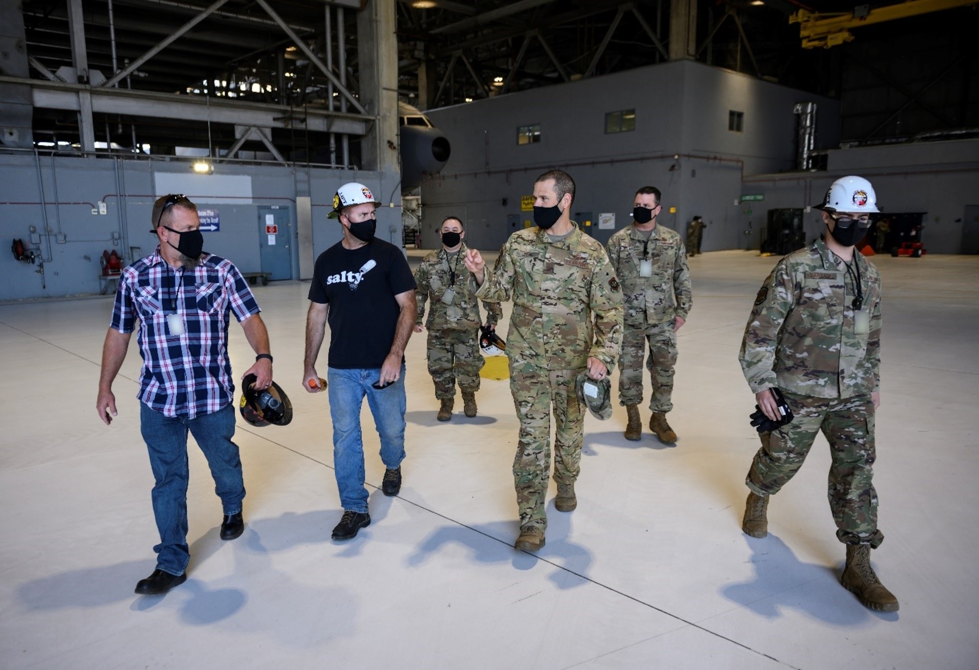 U.S. Air Force Col. Zachery Jiron, third from right, 60th Air Mobility Wing vice commander, speaks with representatives from the 60th Maintenance Squadron May 7, 2021, at Travis Air Force Base, California. Jiron visited the 60th MXS during Leadership Rounds, a program that provides 60th AMW leadership an opportunity to interact with Airmen and receive a detailed view of each mission performed at Travis AFB.