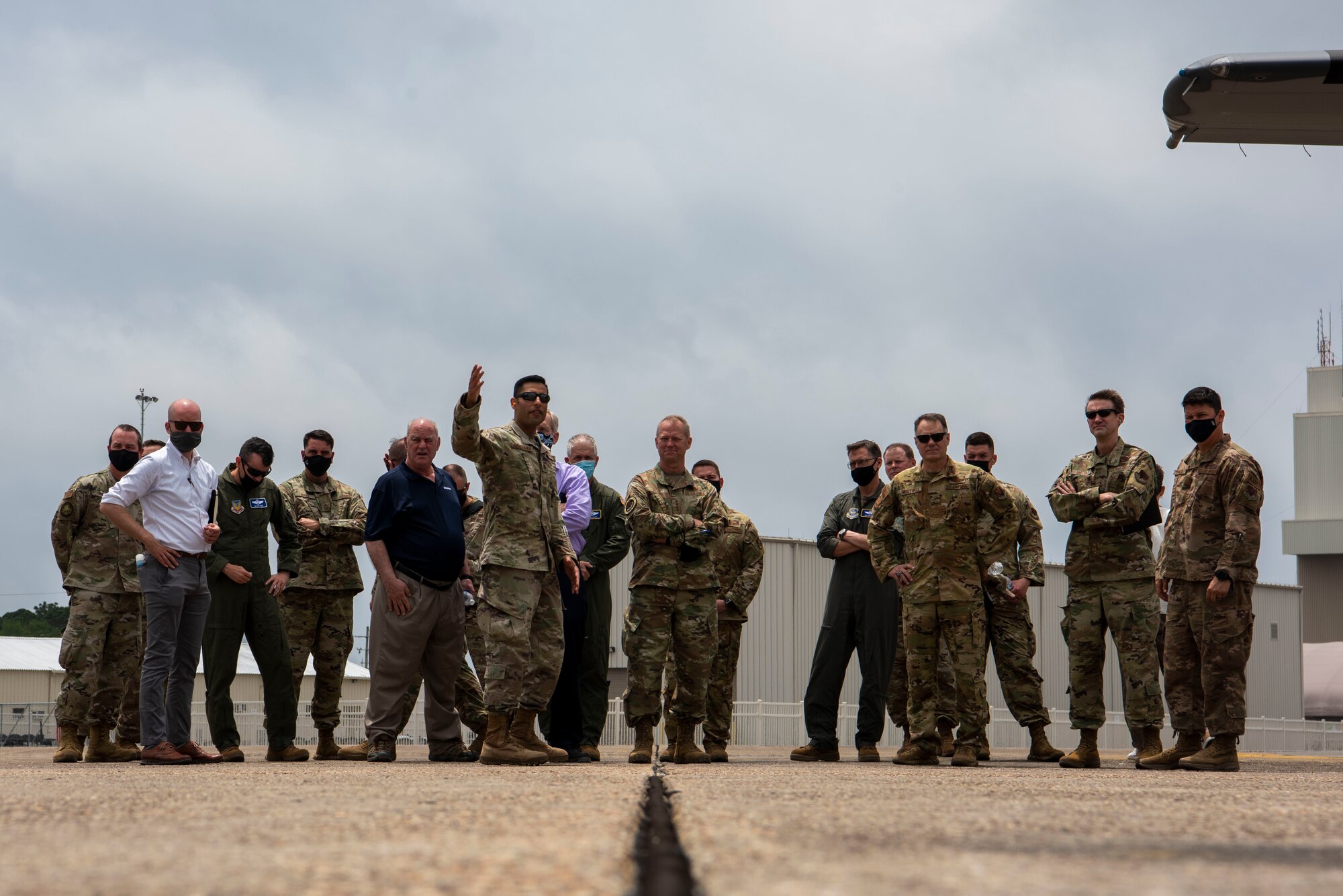 U.S. Air Force Gen. Mark Kelly, commander of Air Combat Command, middle, and more than 20 distinguished visitors observe multi-capable Airmen conduct an integrated combat turn (ICT) at Eglin Air Force Base, Florida, May 4, 2021.