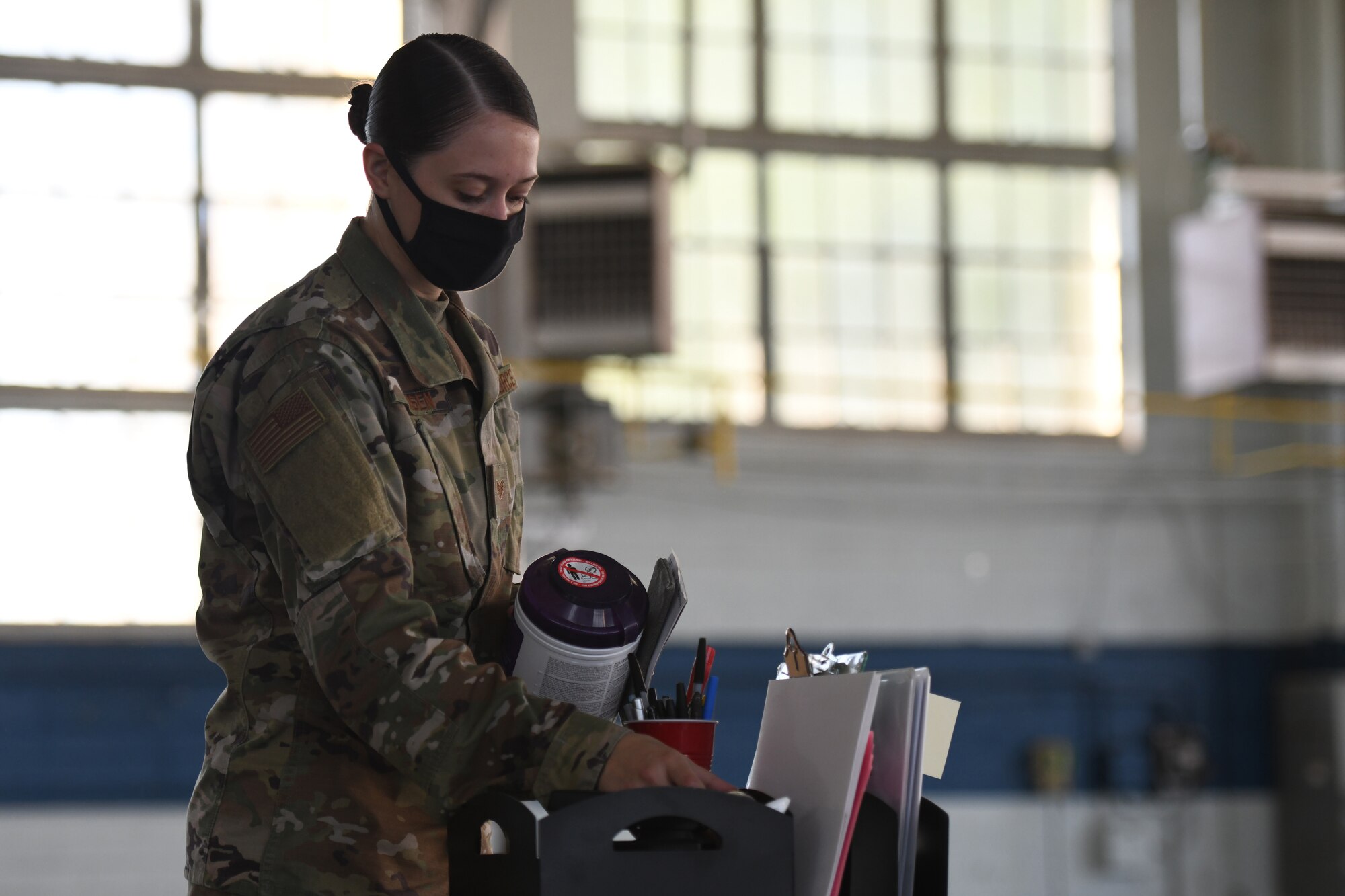 U.S. Air Force Staff Sergeant Amber Hansen, 42nd Medical Group Medical Materialist, collects medical supplies for relocation at Maxwell Air Force Base, Alabama, May 7, 2021. The current COVID-19 vaccination site is moving from Maxwell’s Honor Guard hanger to the Immunizations Clinic.