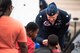 Lt. Col. (Dr.) Noel Colls, United States Air Force Air Demonstration Squadron,“Thunderbirds," flight surgeon, talks to kids visiting the 2021 Defenders of Liberty Air & Space Show at Barksdale Air Force Base, Louisiana, May 9, 2021. Barksdale's Air Show showcased performances from the Thunderbirds, F-22 Raptor Demonstration Team and a host of additional acts. (U.S. Air Force photo by Senior Airman Jacob B. Wrightsman)