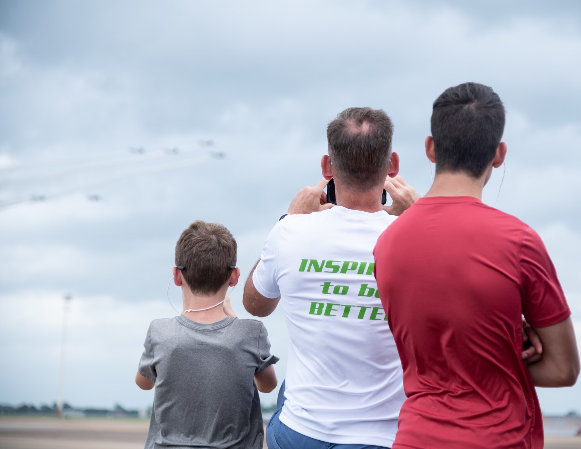 Visitors to Barksdale Air Force Base watch as aircraft from Tora, Tora, Tora fly in formation during the 2021 Defenders of Liberty Air & Space Show at Barksdale Air Force Base, Louisiana, May 9, 2021. The Defenders of Liberty air show was first held in 1933 and is a full weekend of military and civilian aircraft, with performances and displays. (U.S. Air Force photo by Airman 1st Class William Pugh)