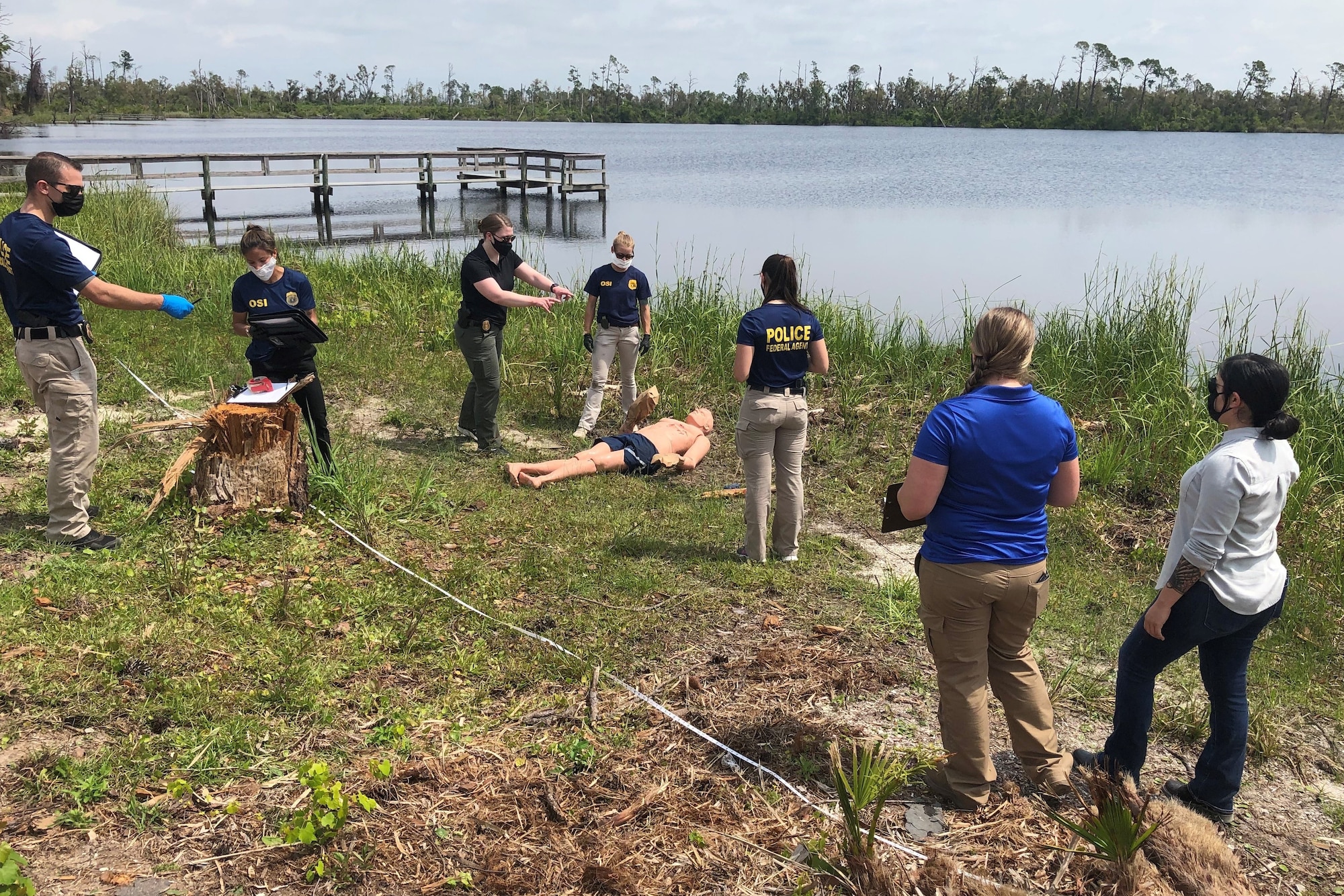 Special Agents from Office of Special Investigations Detachment 223, team with a 2nd Field Investigations Squadron Forensic Science Consultant and Investigators from the 325th Security Forces Squadron Investigations, to process a crime scene scenario during an exercise at Tyndall Air Force Base, Fla., April 30, 2021. (Photo by SA Kevin Sucher)