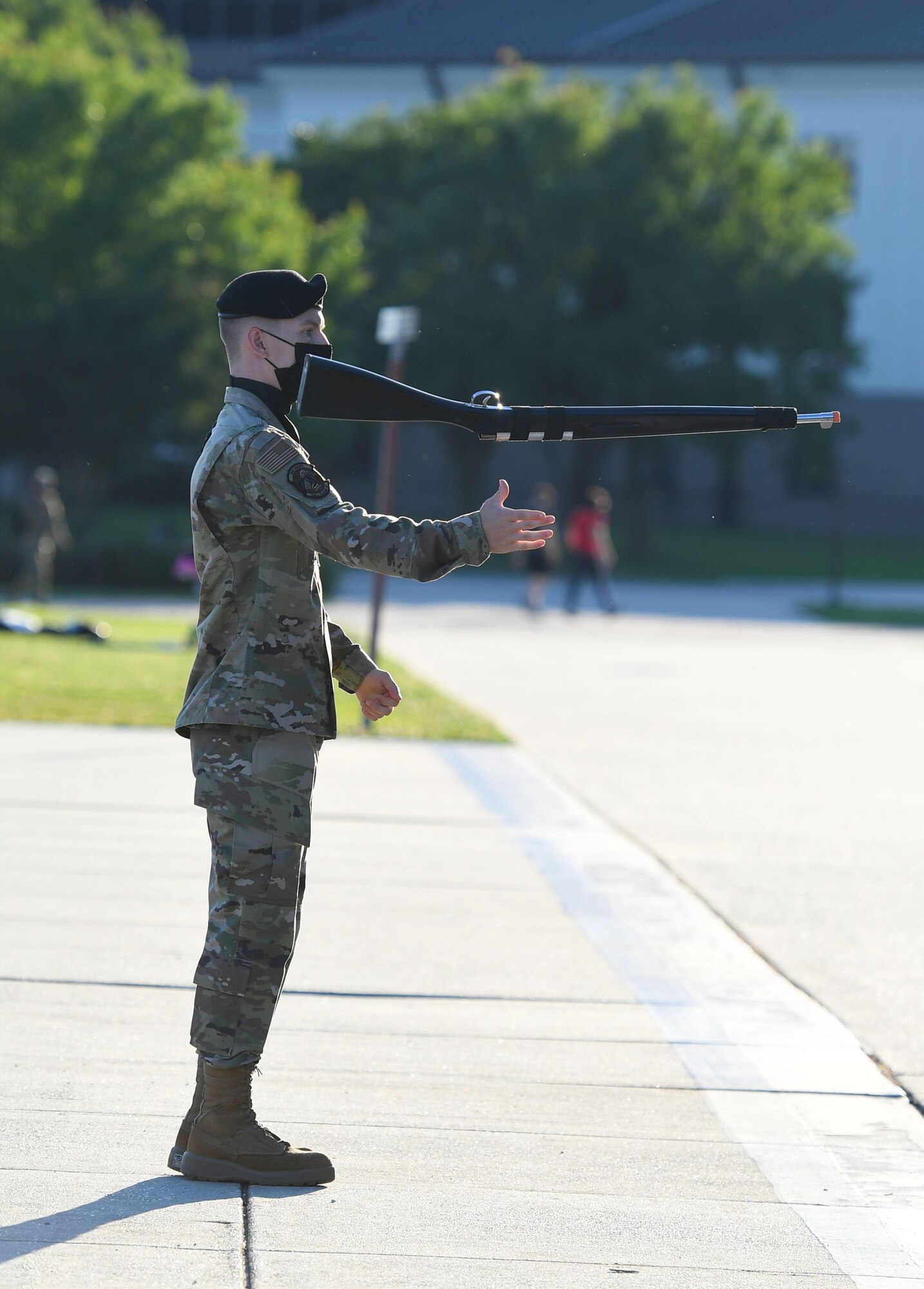 U.S. Air Force Airman 1st Class Zachery Lemon, 338th Training Squadron freestyle drill team member, performs during the 81st Training Group drill down on the Levitow Training Support Facility drill pad at Keesler Air Force Base, Mississippi, May 6, 2021. Airmen from the 81st TRG competed in a quarterly open ranks inspection, regulation drill routine and freestyle drill routine. While in training, Airmen are given the opportunity to volunteer to learn and execute drill down routines. (U.S. Air Force photo by Kemberly Groue)