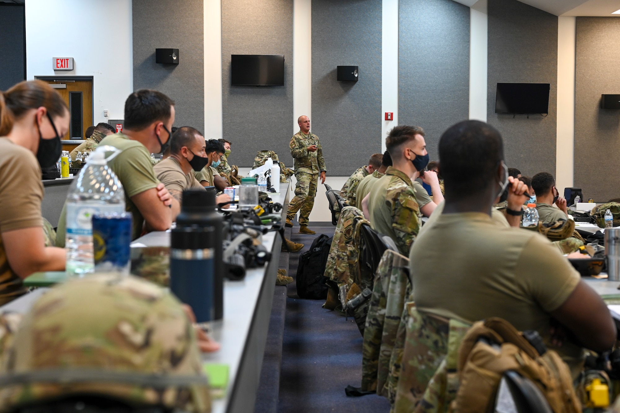 U.S. Air Force 1st Lt. Stephen McShane, combat readiness school instructor assigned to the 644th Combat Communications Squadron, leads a class during exercise Dragon Forge on North West Field, Guam, April 8, 2021. Exercise Dragon Forge is a combat skills training course that prepares participants to deploy to austere locations. (U.S. Air Force photo by Tech. Sgt. Esteban Esquivel)