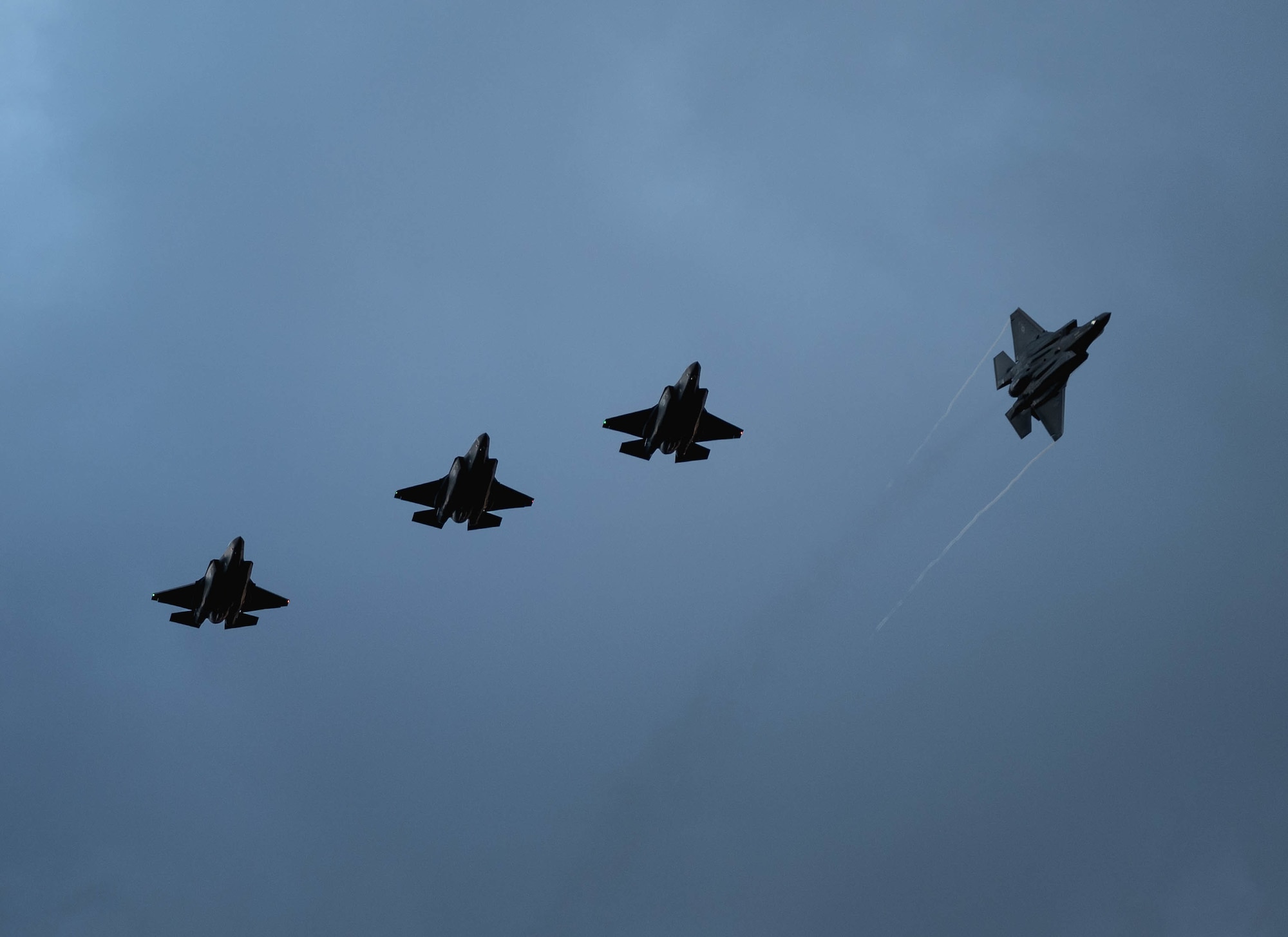 Four U.S. Air Force F-35A Lightning IIs assigned to the 4th Fighter Squadron, Hill Air Force Base, Utah, fly over Mont-de-Marsan Air Base, France, upon arrival May 10, 2021. During their time in the European theater, the 4th FS aircraft will participate in multiple events, including Atlantic Trident 21, underscoring the steadfast U.S. commitment to the region and enhancing interoperability with NATO allies and partners. (U.S. Air Force photo by Staff Sgt. Alexander Cook)