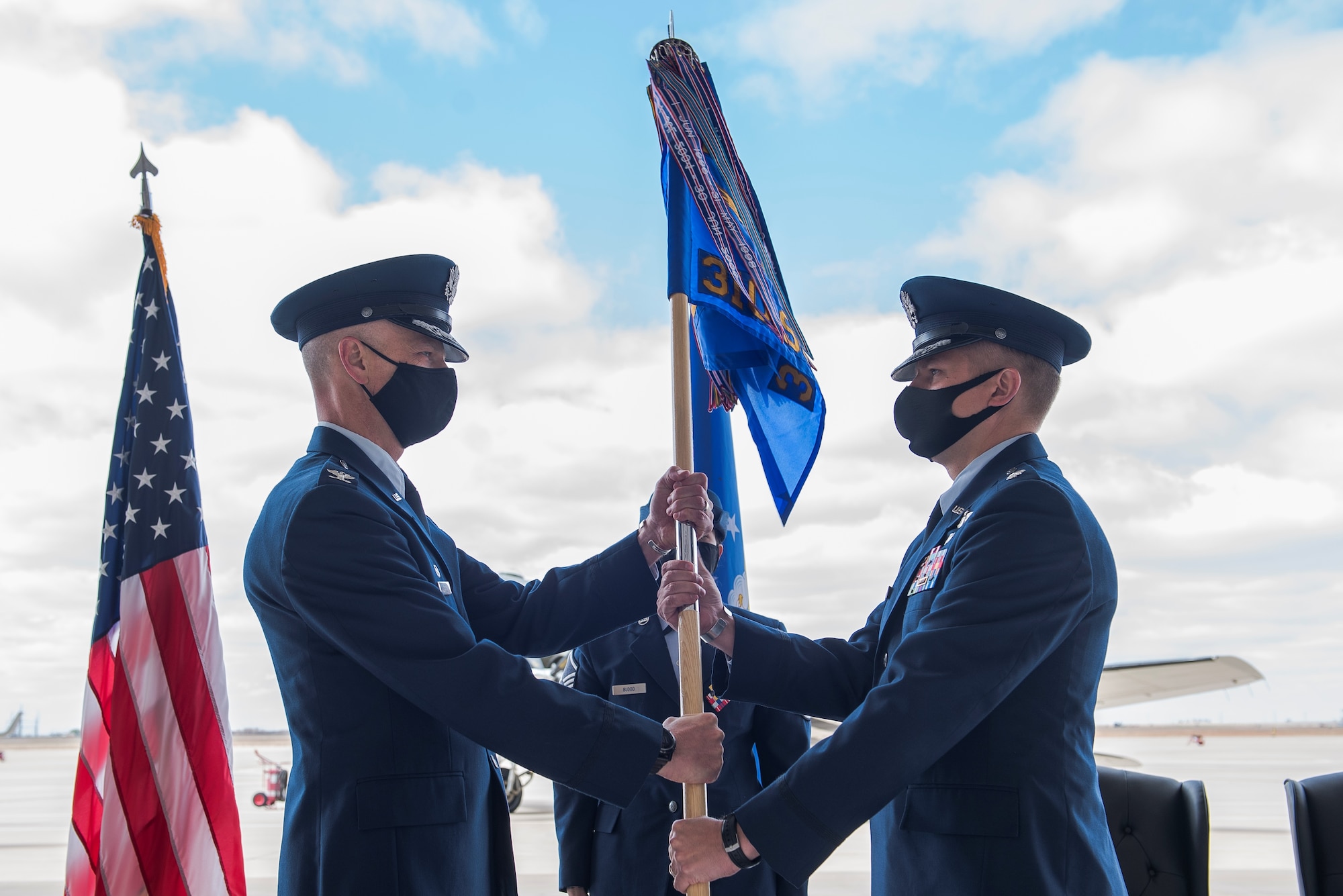 Air Force Col. Michael Shreves (left), 27th Special Operations Group commander, passes the guidon to Air Force Lt. Col. Joshua Stinson (right), 310th Special Operations Squadron commander, at the 310 SOS activation ceremony at Cannon Air Force Base, N.M., May 4, 2021. The 310 SOS was activated recently to align with the Air Force Special Operations Command’s new deployment plans, providing a more sustainable and predictable deployment cycle to allow Air Commandos more time at home station to develop themselves and the culture of the squadron. (U.S. Air Force photo by Senior Airman Vernon R. Walter III)