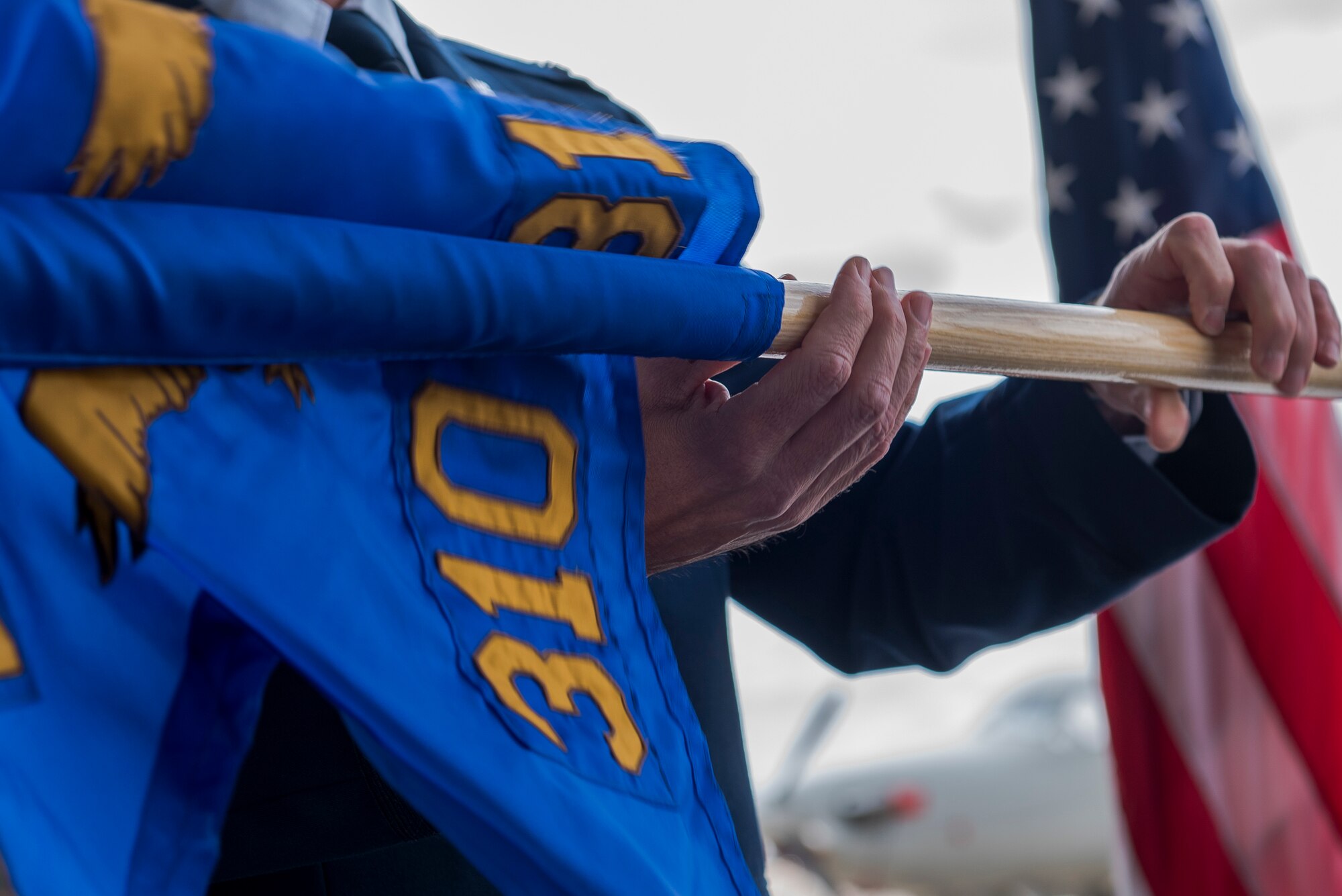 Air Force Col. Michael Shreves, 27th Special Operations Group commander, unfurls the new squadron guidon for the 310th Special Operations Squadron at the 310 SOS activation ceremony at Cannon Air Force Base, N.M., May 4, 2021. The 310 SOS was activated recently to align with the Air Force Special Operations Command’s new deployment plans, providing a more sustainable and predictable deployment cycle to allow Air Commandos more time at home station to develop themselves and the culture of the squadron. (U.S. Air Force photo by Senior Airman Vernon R. Walter III)