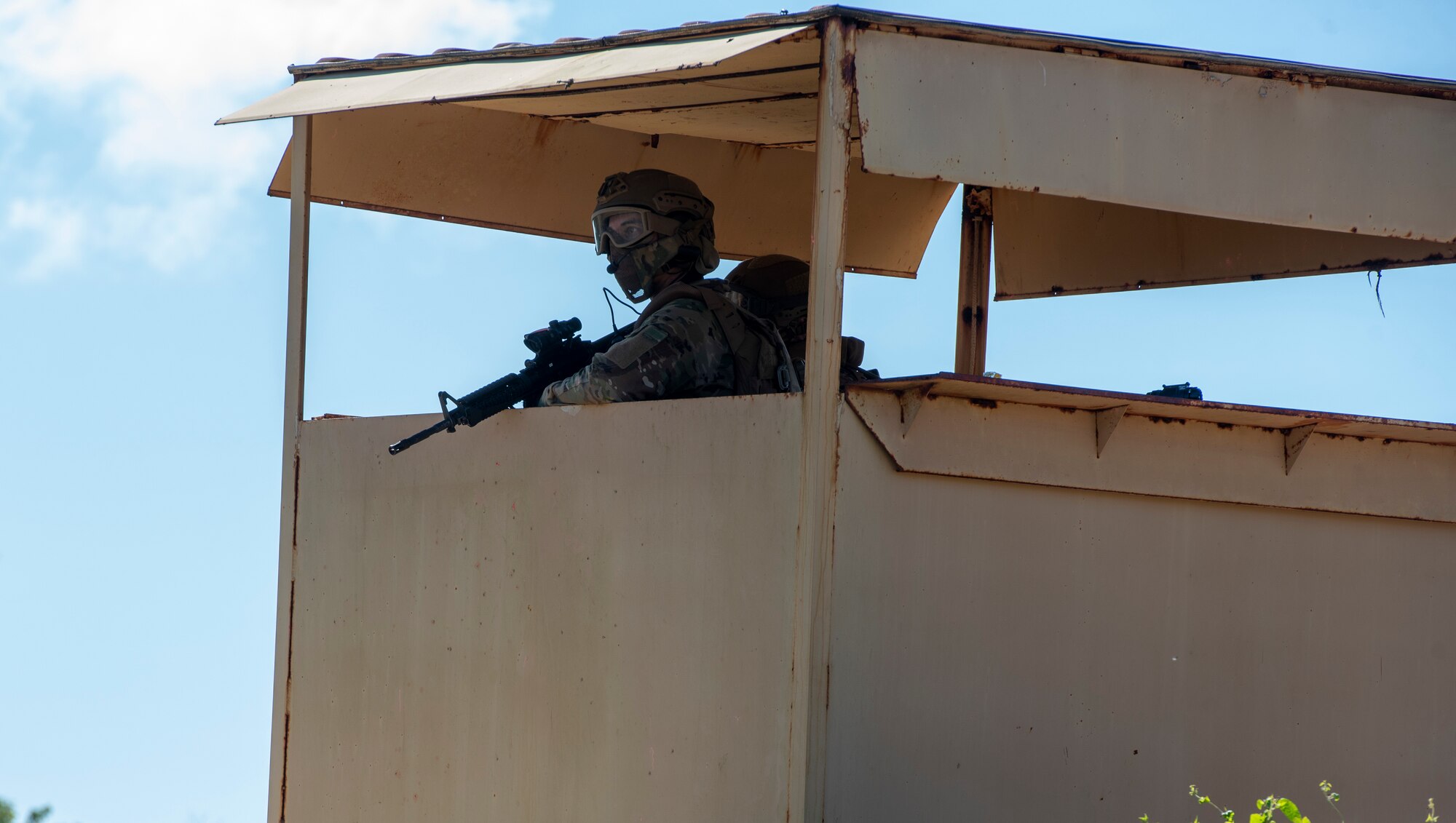 An U.S. Air Force Airman assigned to the 644th Combat Communications Squadron, provides overwatch during a field training exercise on North West Field, Guam, April 22, 2021. Students were tested on the skills and knowledge they gained over the past several weeks during exercise Dragon Forge. Exercise DF is a combat skills training course that prepares participants to deploy to austere locations. (U.S. Air Force photo by Senior Airman Helena Owens)