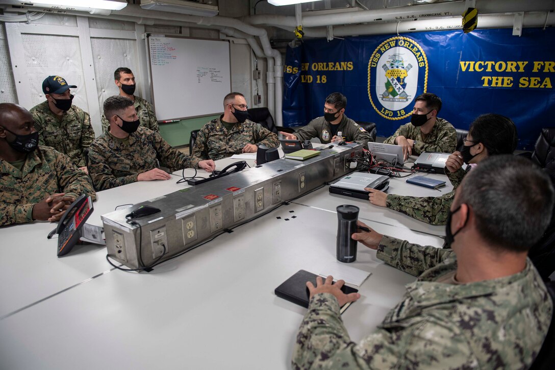 SASEBO, Japan (April 26, 2021) U.S. Navy and Marine Corps officers partake in a video teleconference onboard amphibious transport dock ship USS New Orleans (LPD 18) as part of Fleet Synthetic Training-Joint. New Orleans, part of the America Amphibious Ready Group, along with the 31st Marine Expeditionary Unit, is operating in the U.S. 7th Fleet area of responsibility to enhance interoperability with allies and partners and serve as a ready response force to defend peace and stability in the Indo-Pacific region. (U.S. Navy photo by Mass Communication Specialist Communication Specialist 2nd Class Kelby Sanders)